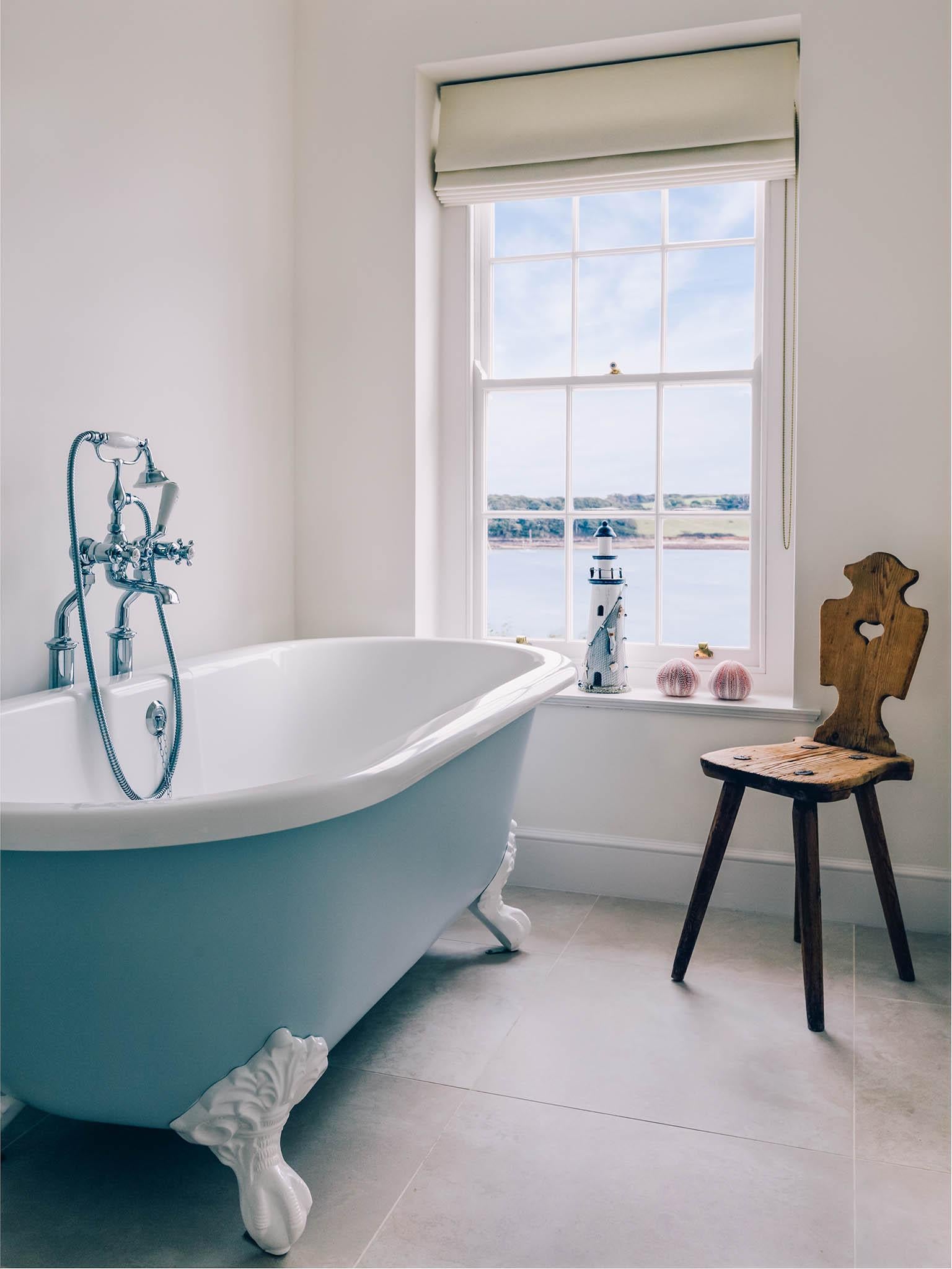 The house has two free-standing baths, both overlooking the bay