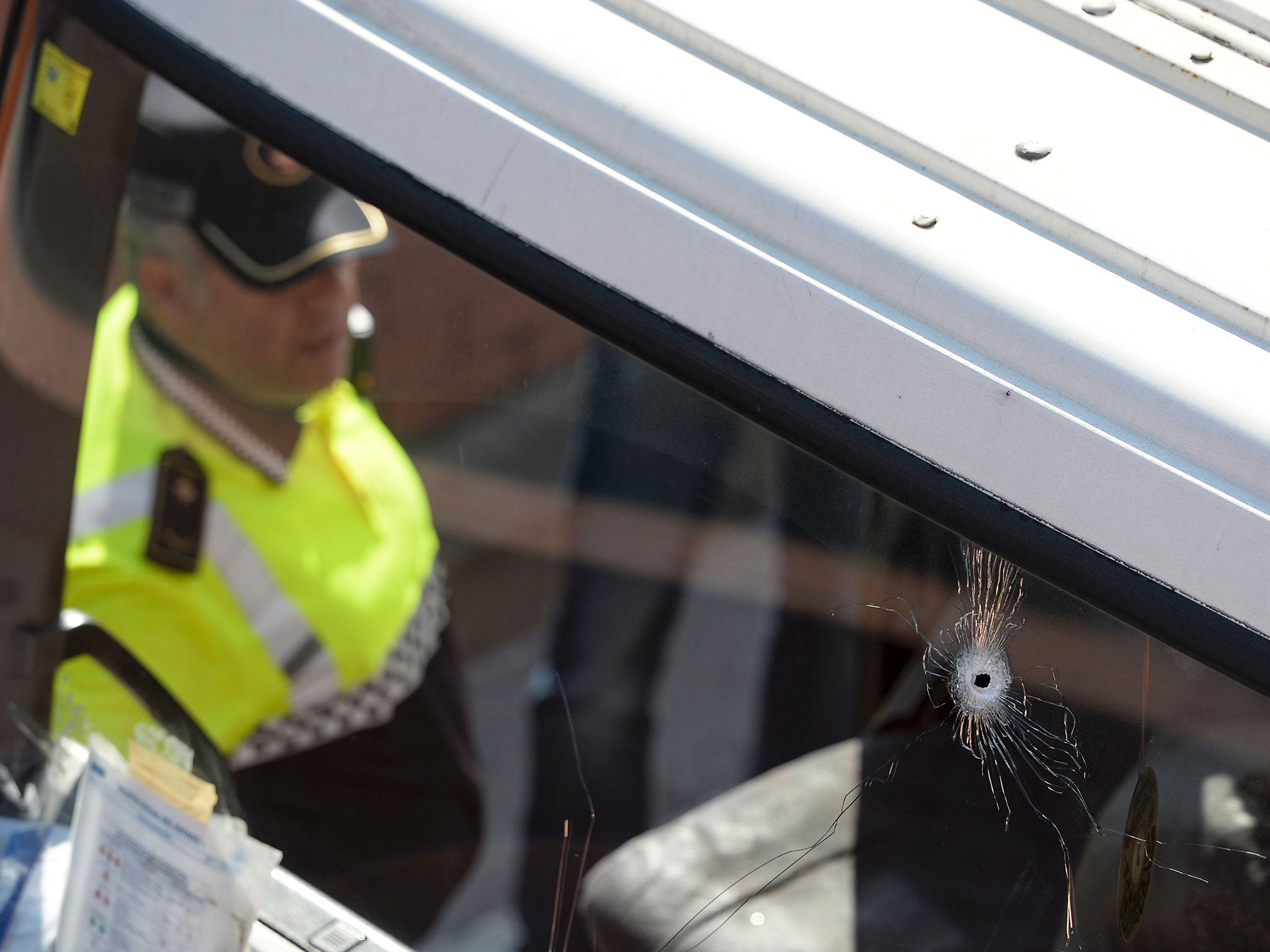 Bullet holes are seen on the windscreen of a stolen butane gas delivery lorry in Barcelona on 21 February