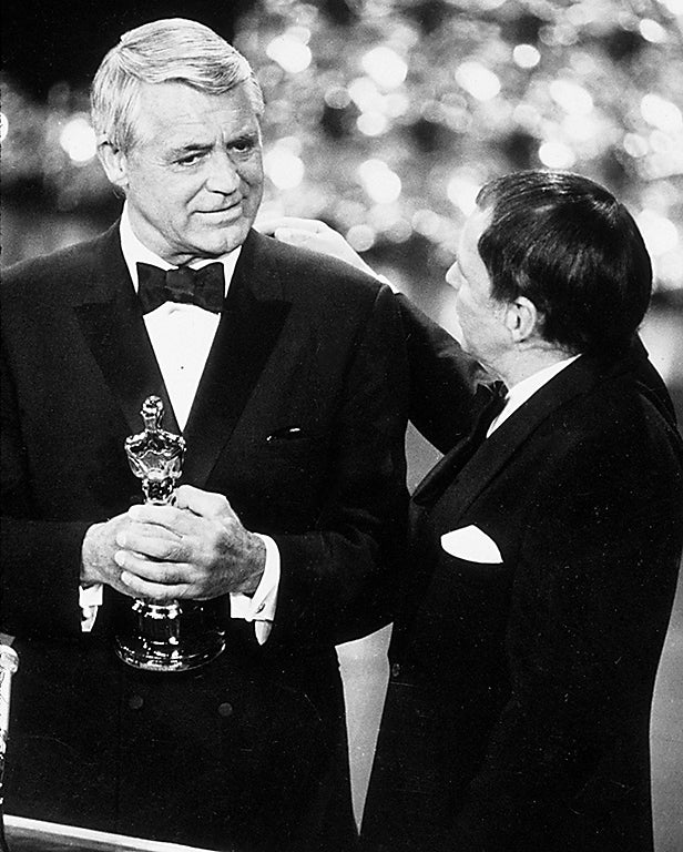 Cary Grant receiving an Honorary Oscar in 1969 from Frank Sinatra