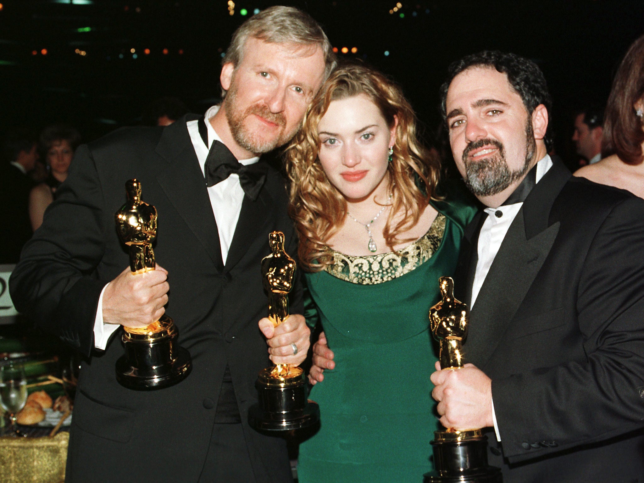 ‘Titanic’ director James Cameron, actress Kate Winslet and producer Jon Landau with their Oscars at the 1997 ceremony. The film was nominated for 14 Academy Awards and won 11