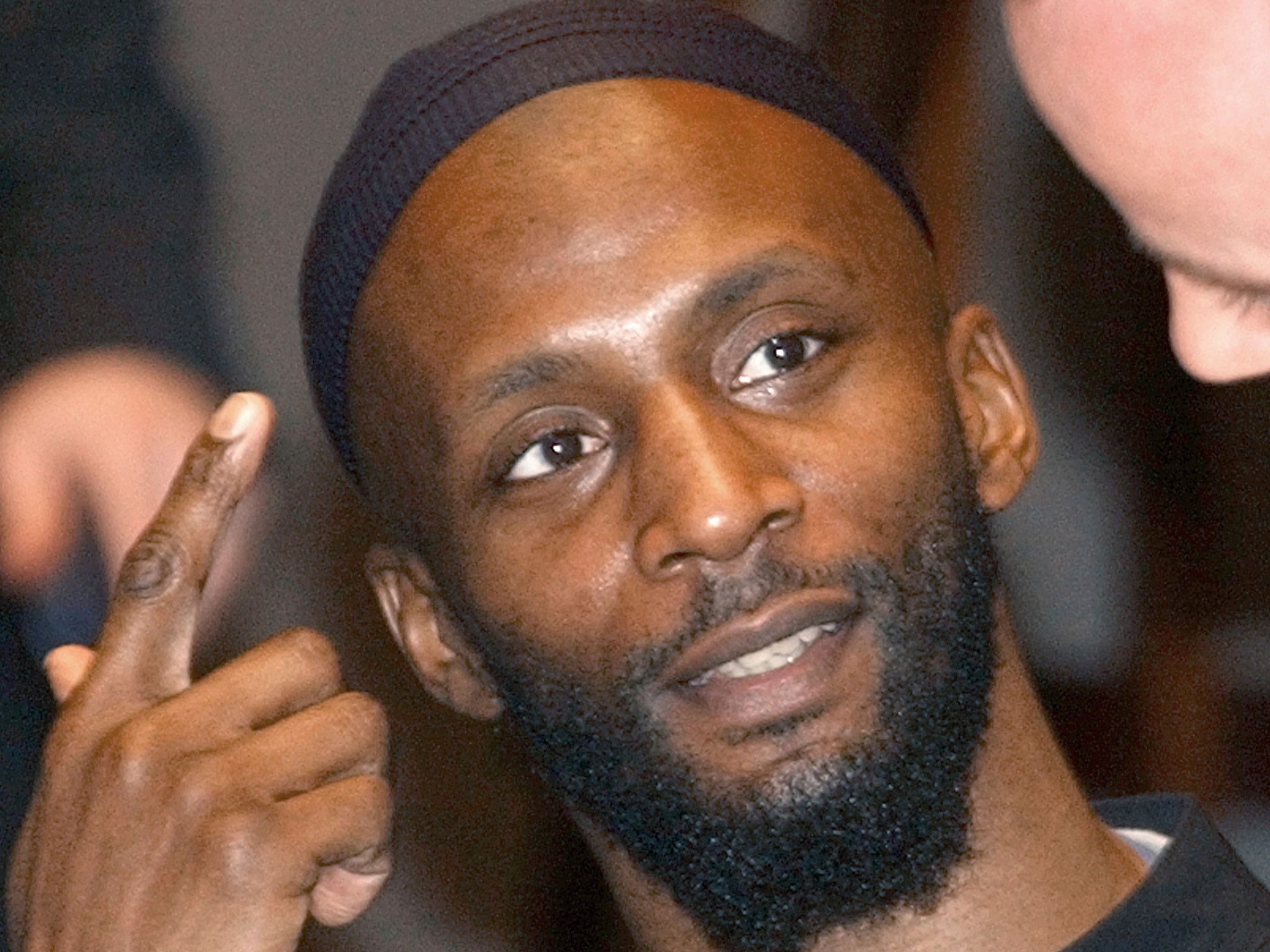 Jamal al-Harith, a former inmate at Guantanamo Bay, gestures after his testimony to Europe's top human rights body in Paris in 2004