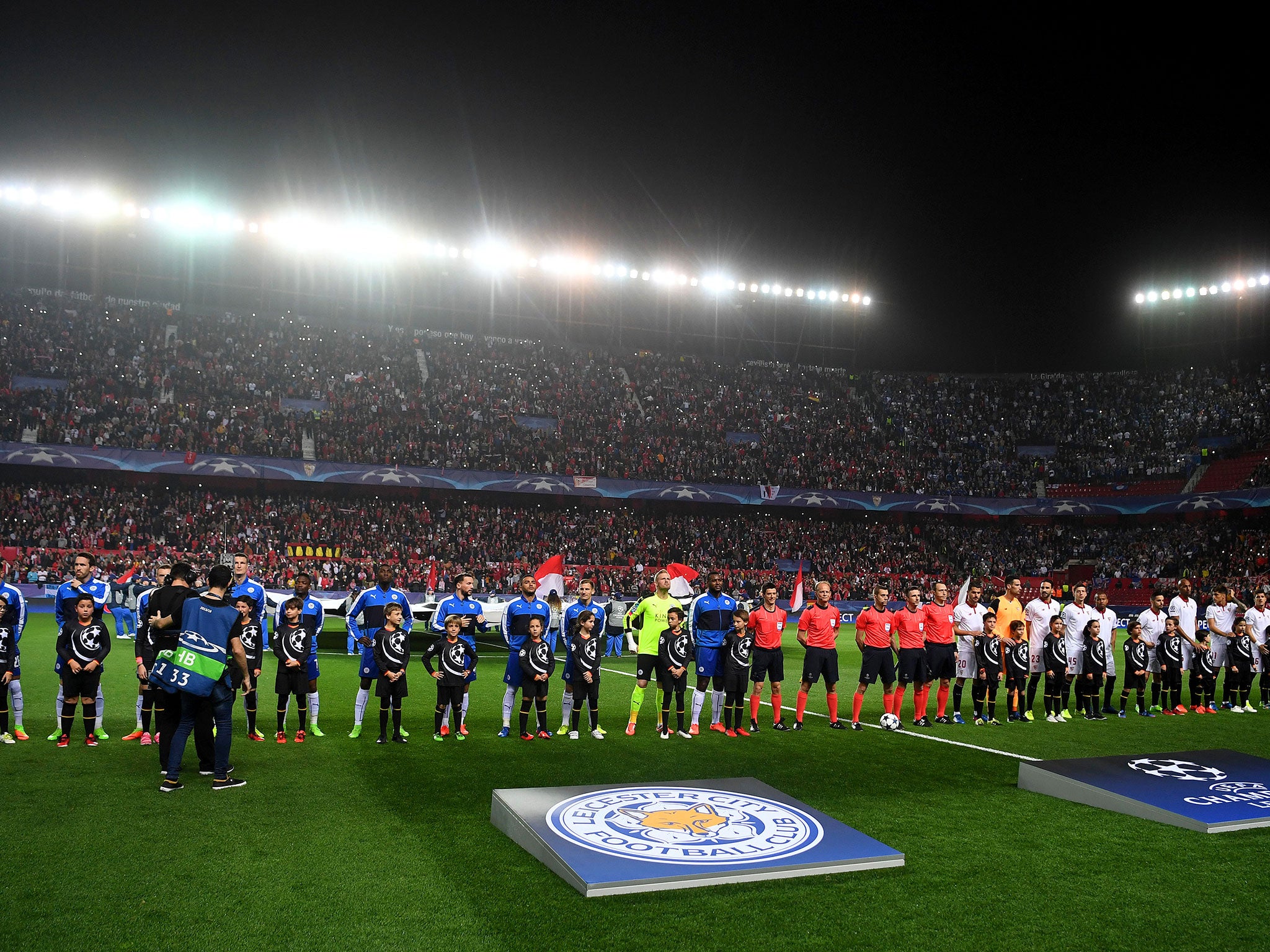 The two teams line up before kick off