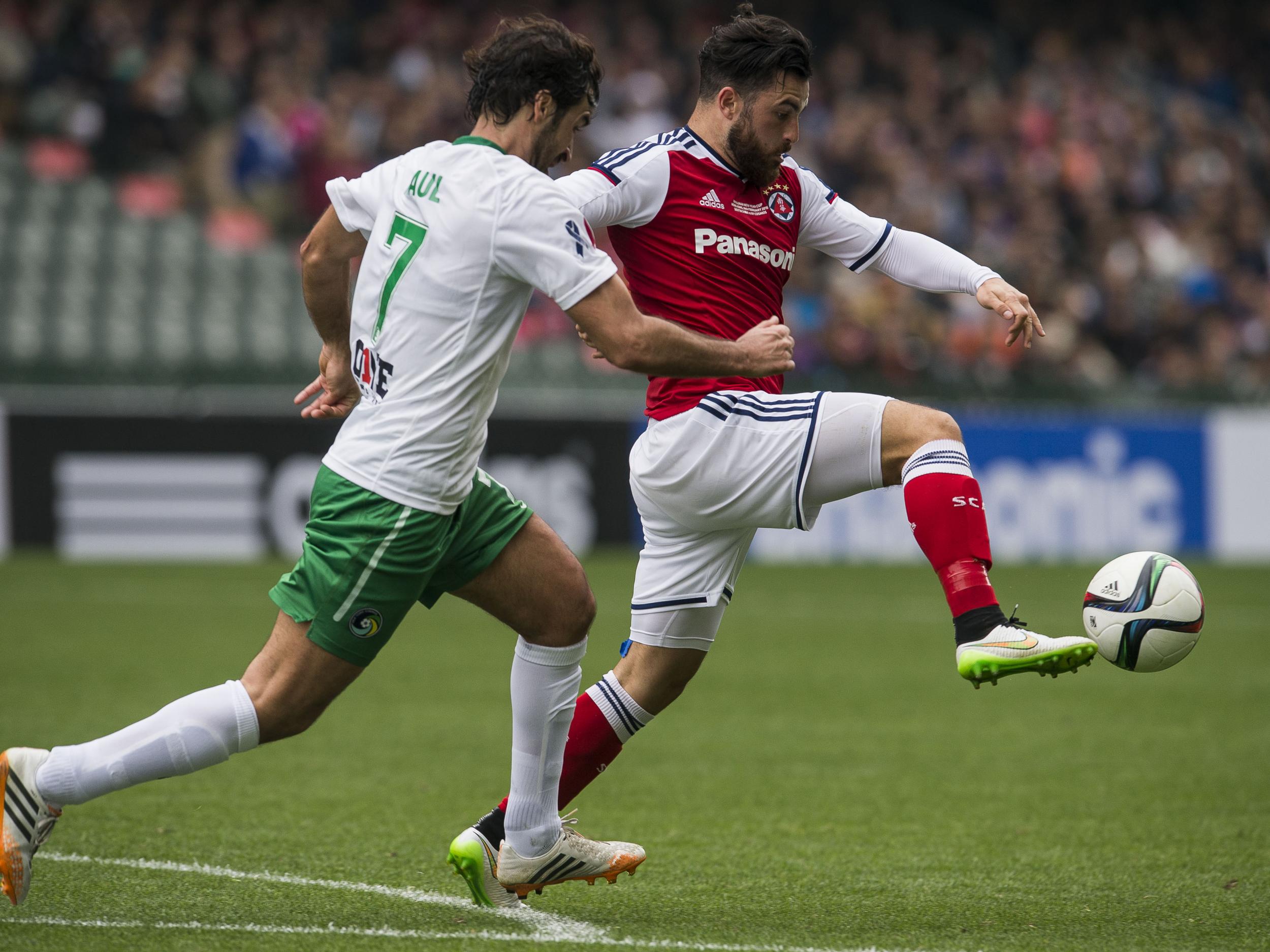 Sealy (R) in action for former club, South China AA