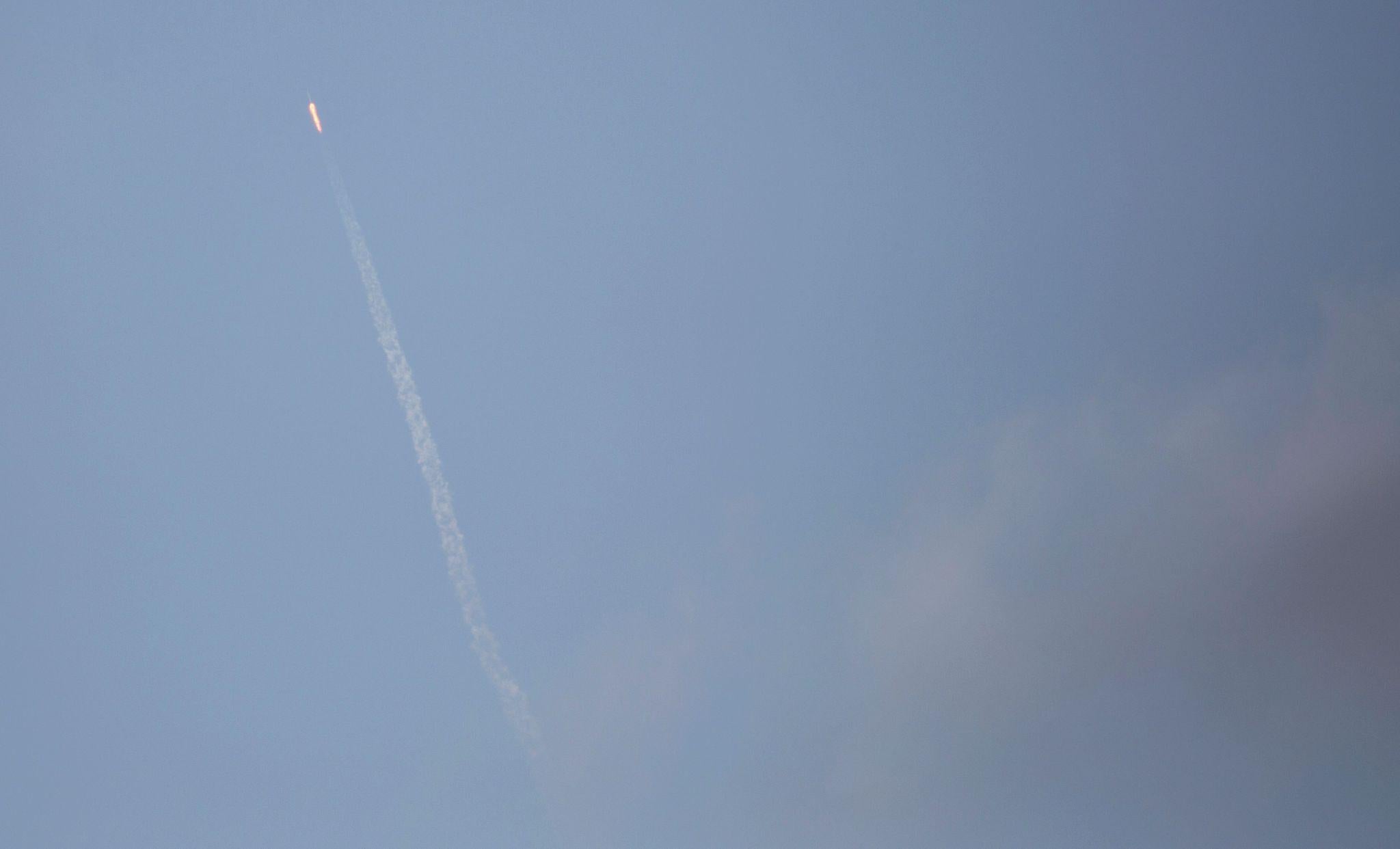 The SpaceX Falcon 9 rocket, carrying a Dragon cargo capsule, is seen from Port Canaveral, Florida, as it launches from the Kennedy Space Center Launch Complex 39A on February 19, 2017