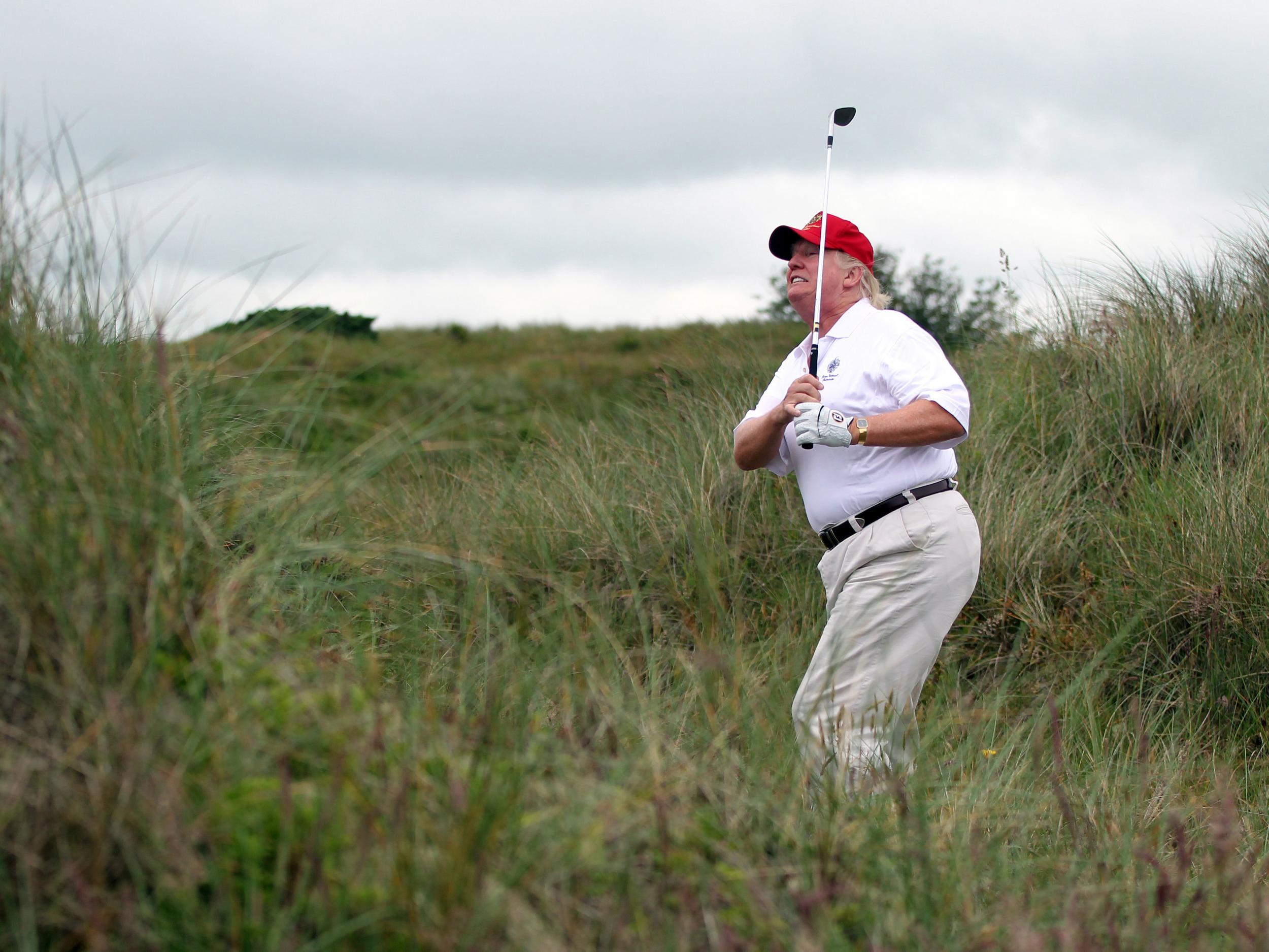 Donald Trump is known as being an avid golfer. Here, he tees off at the The Trump International Golf Links Course in Balmedie, Scotland.