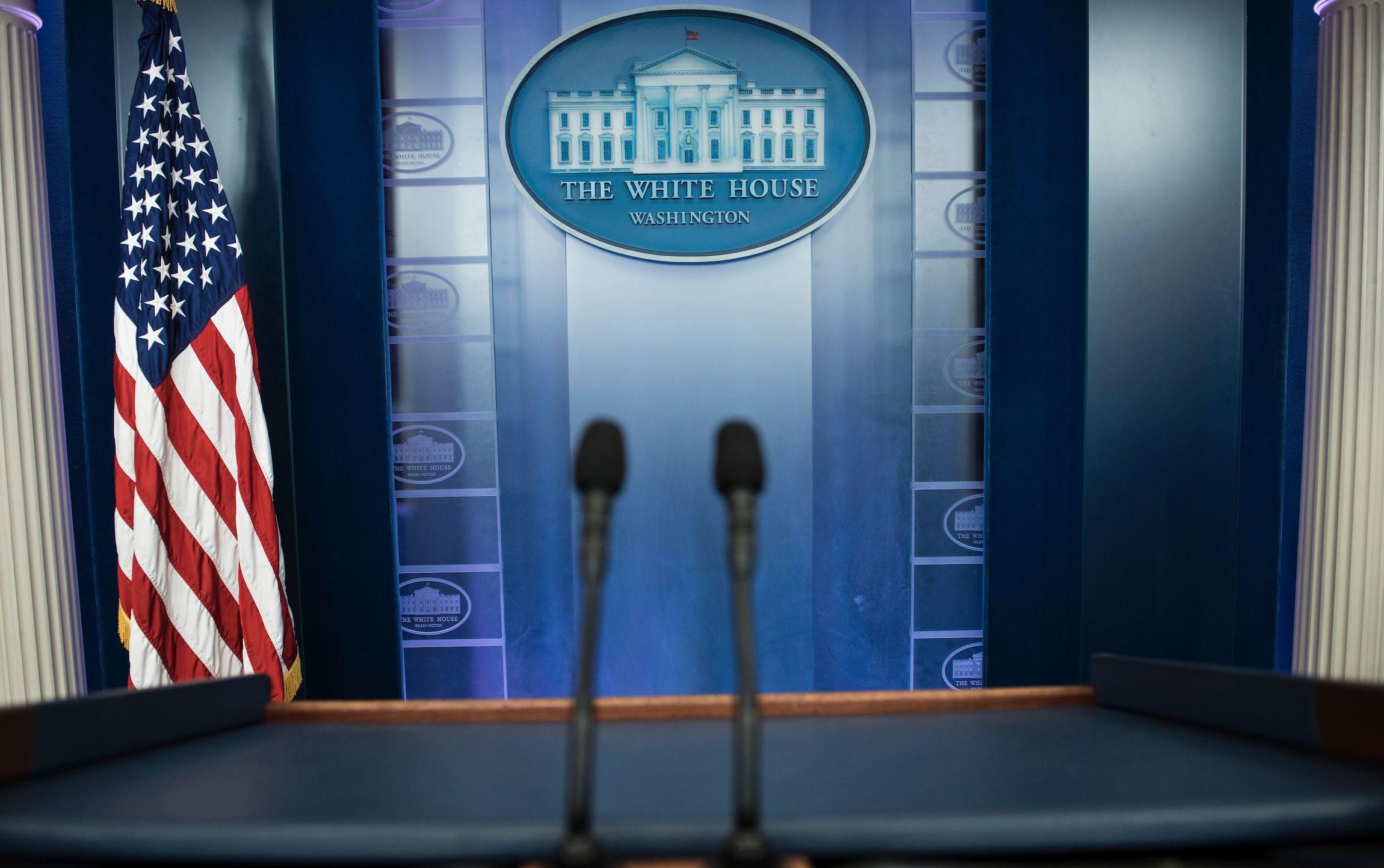 An empty podium is seen as an off camera briefing is held with a group of reporters in Washington DC on February 24, 2017.