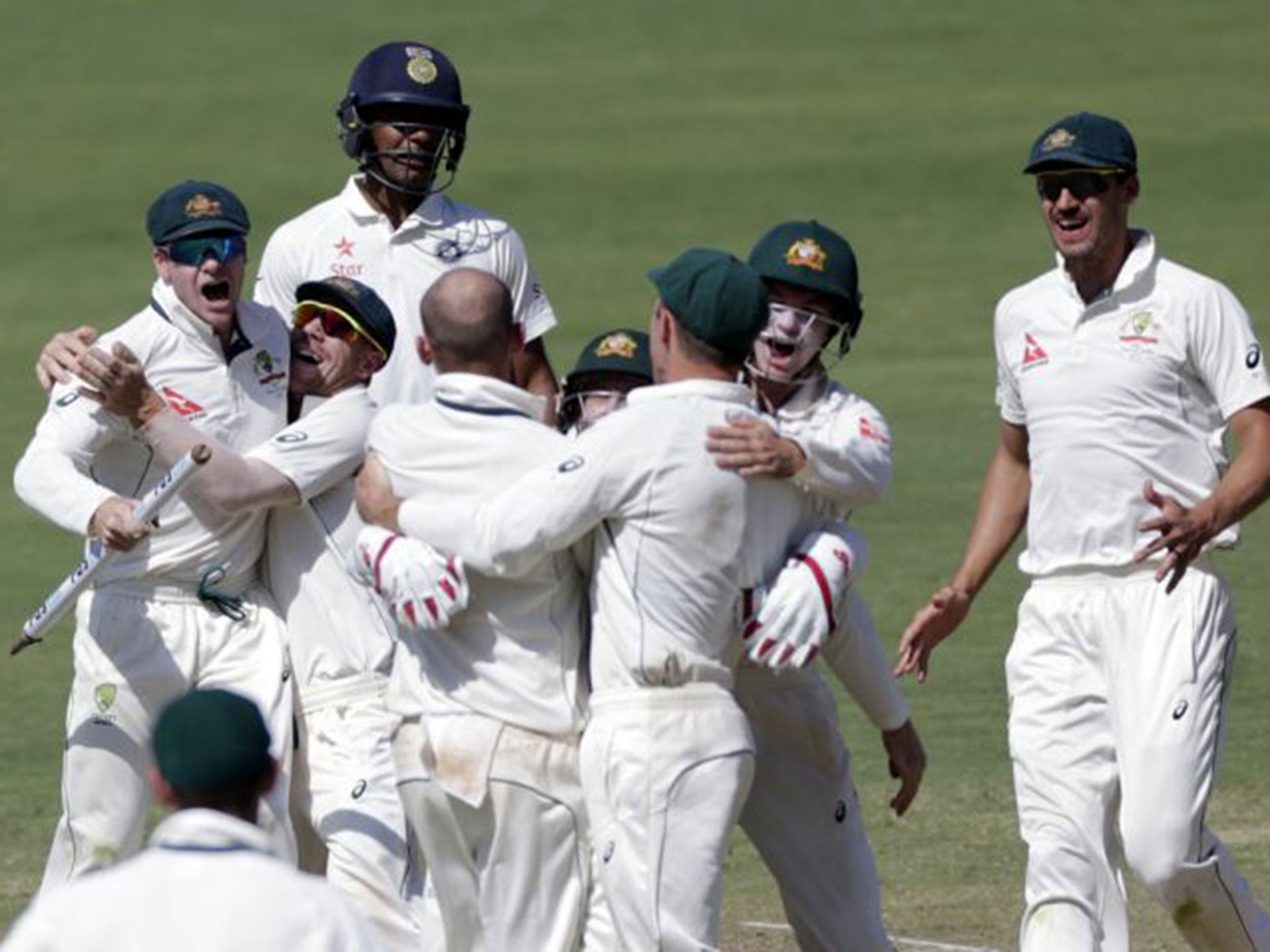 Australia celebrate a 333-run victory over India in the first Test