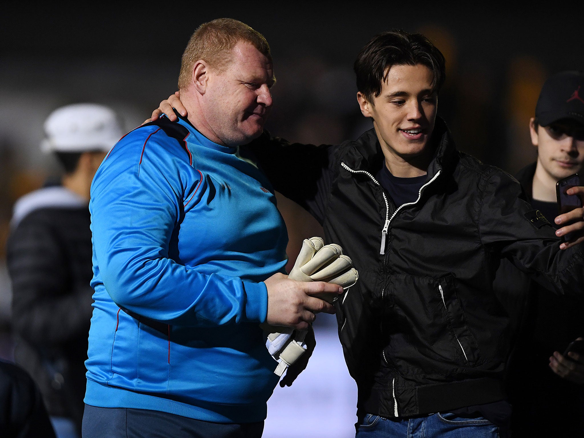 Wayne Shaw with a fan after Sutton's 2-0 defeat by Arsenal on Monday night