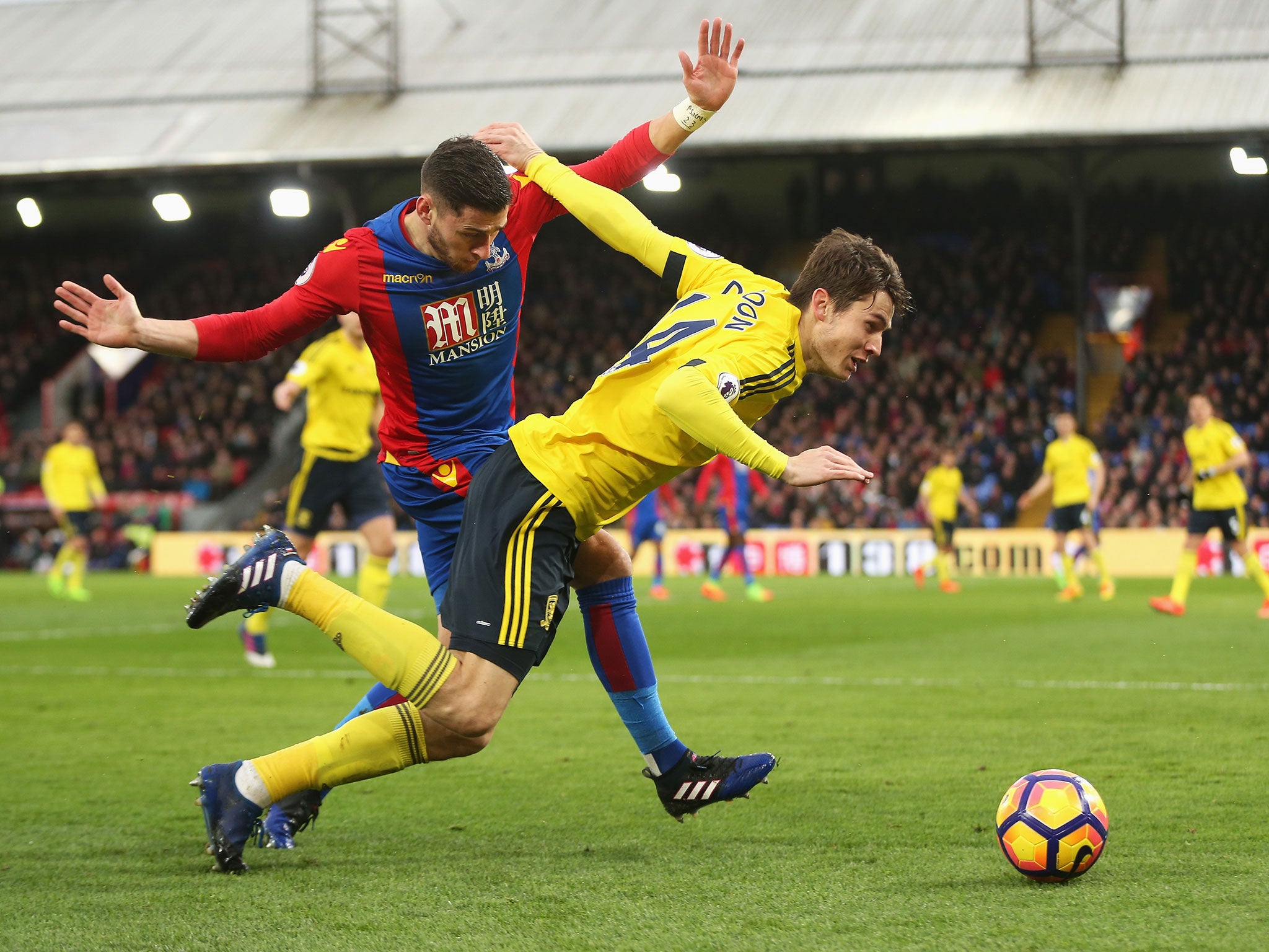 Marten de Roon and Joel Ward tussle for possession