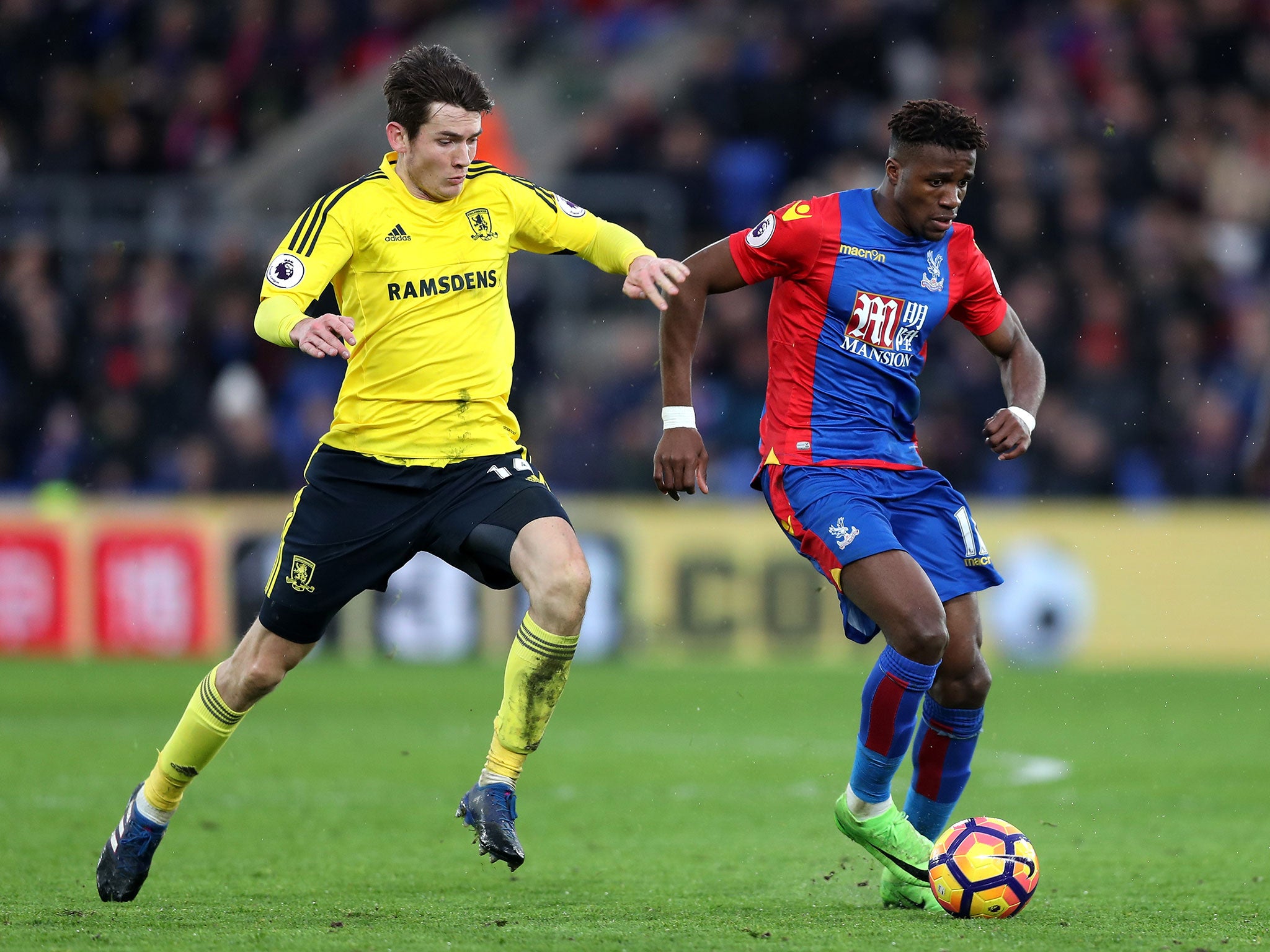 Wilfried Zaha bids to get away from Marten de Roon