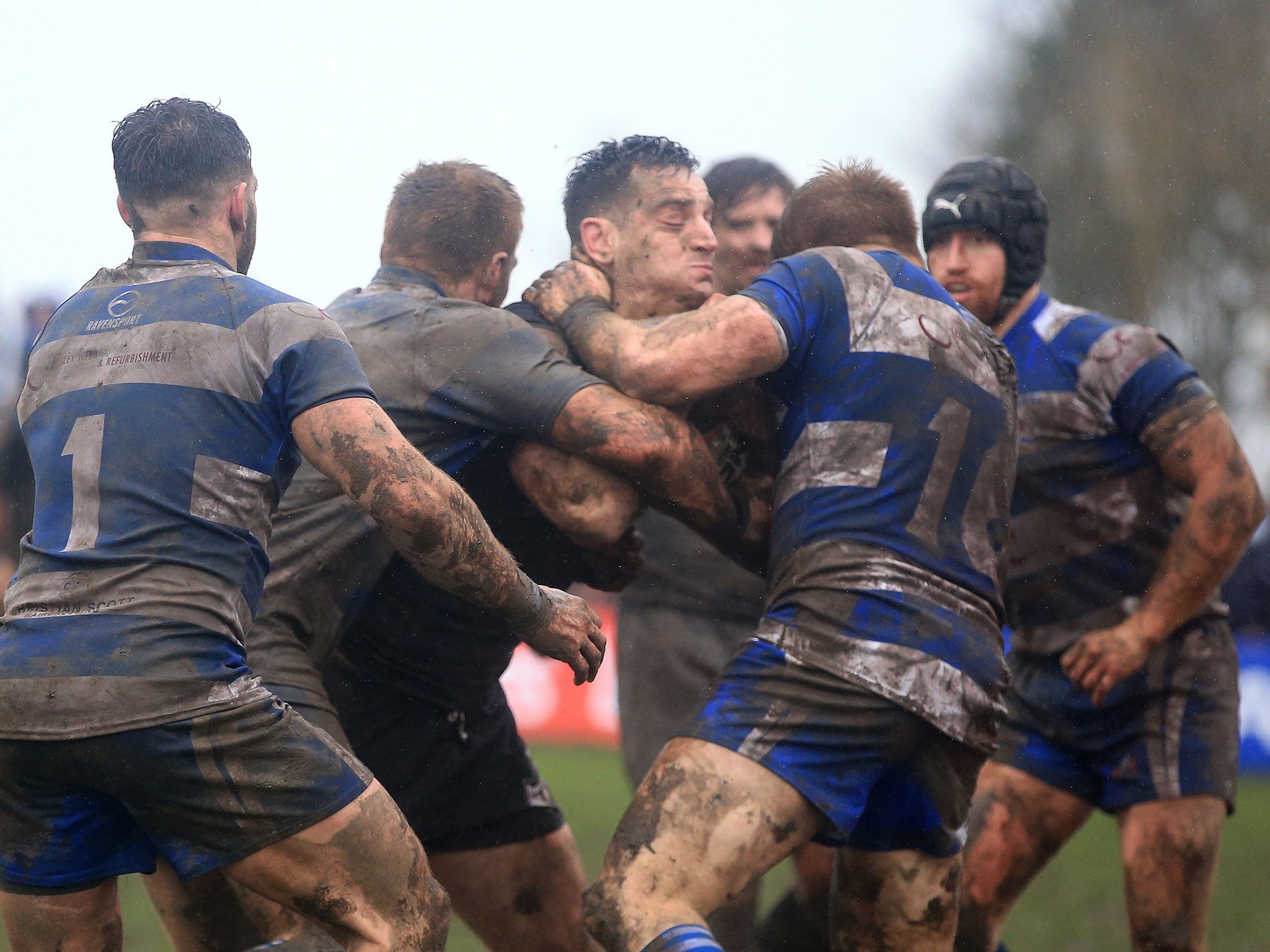 Toronto Wolfpak's Craig Hall is held up by the Siddal defence