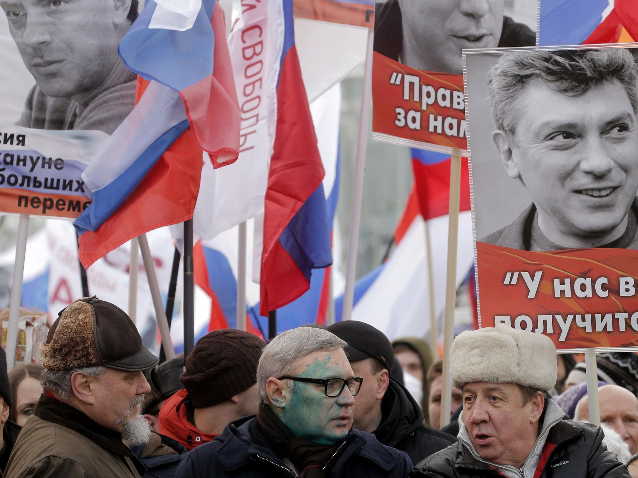 Green paint was thrown at former Russian prime minister and Liberal opposition leader Mikhail Kasyanov during the second anniversary of Boris Nemtsov's murder in Moscow (EPA )