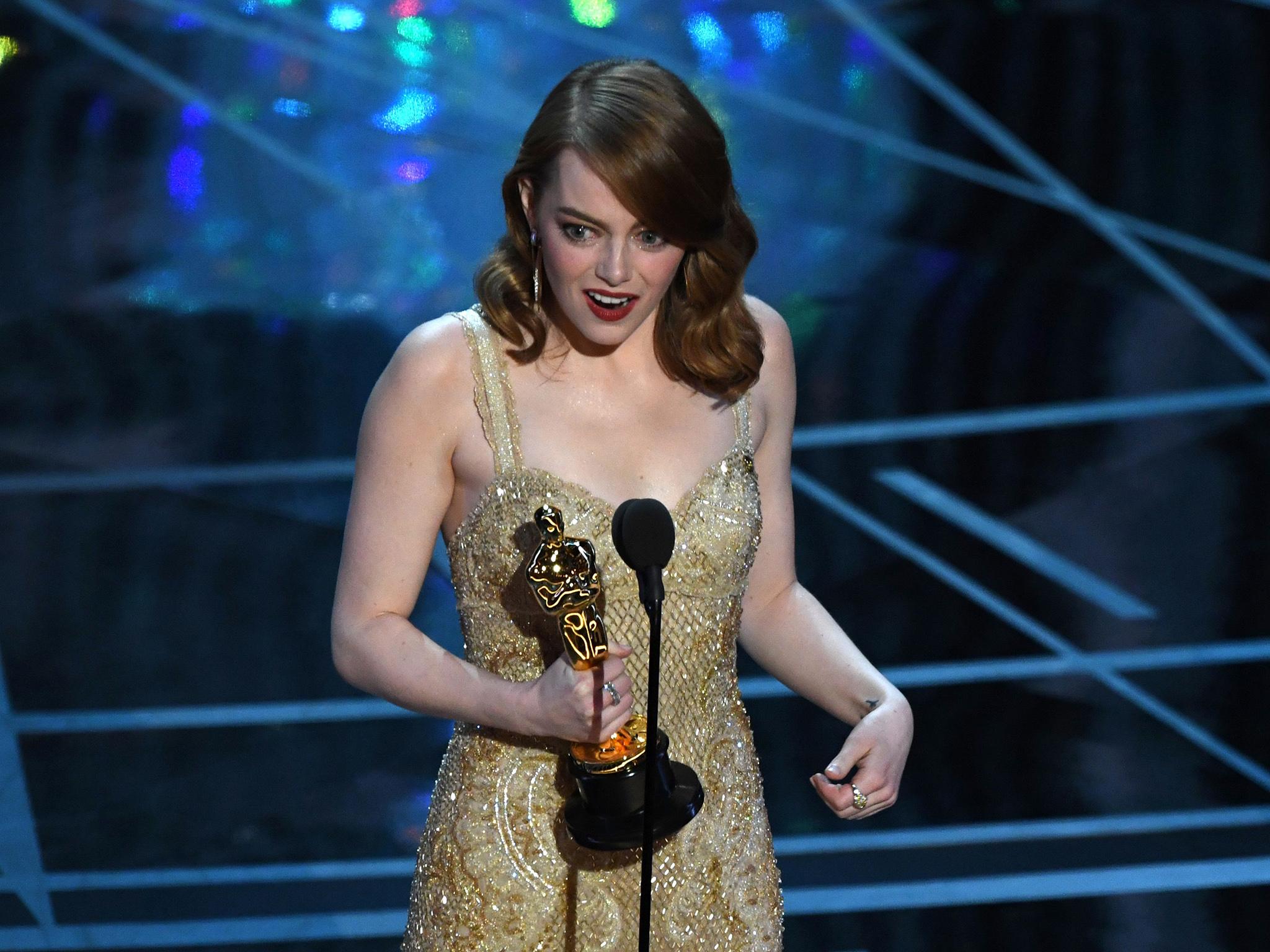 Emma Stone delivers a speech on stage after she won the Best Actress award in "La La Land" at the 89th Oscars