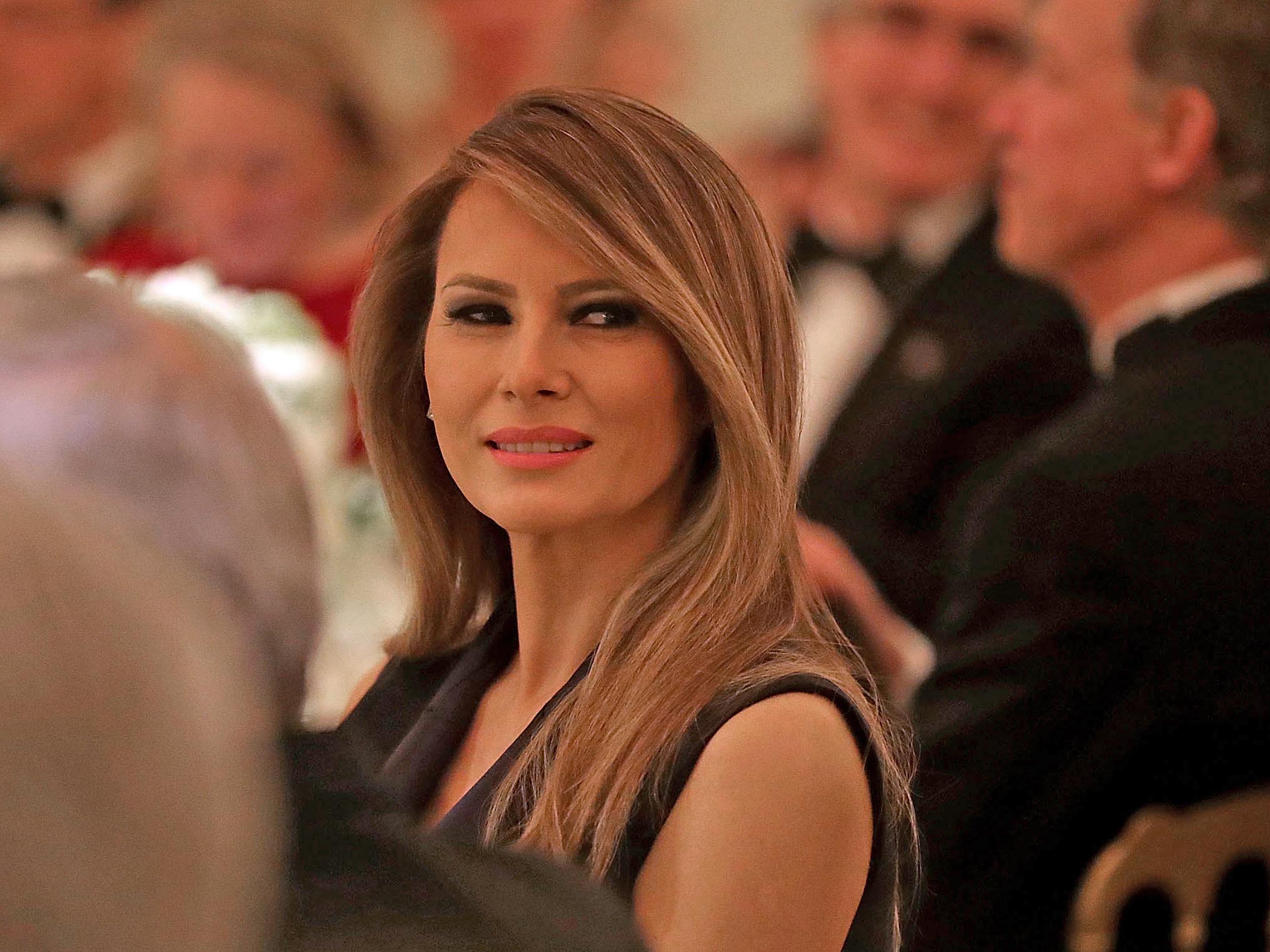 &#13;
First Lady Melania Trump listens to a toast by her husband during the Governors' Dinner &#13;