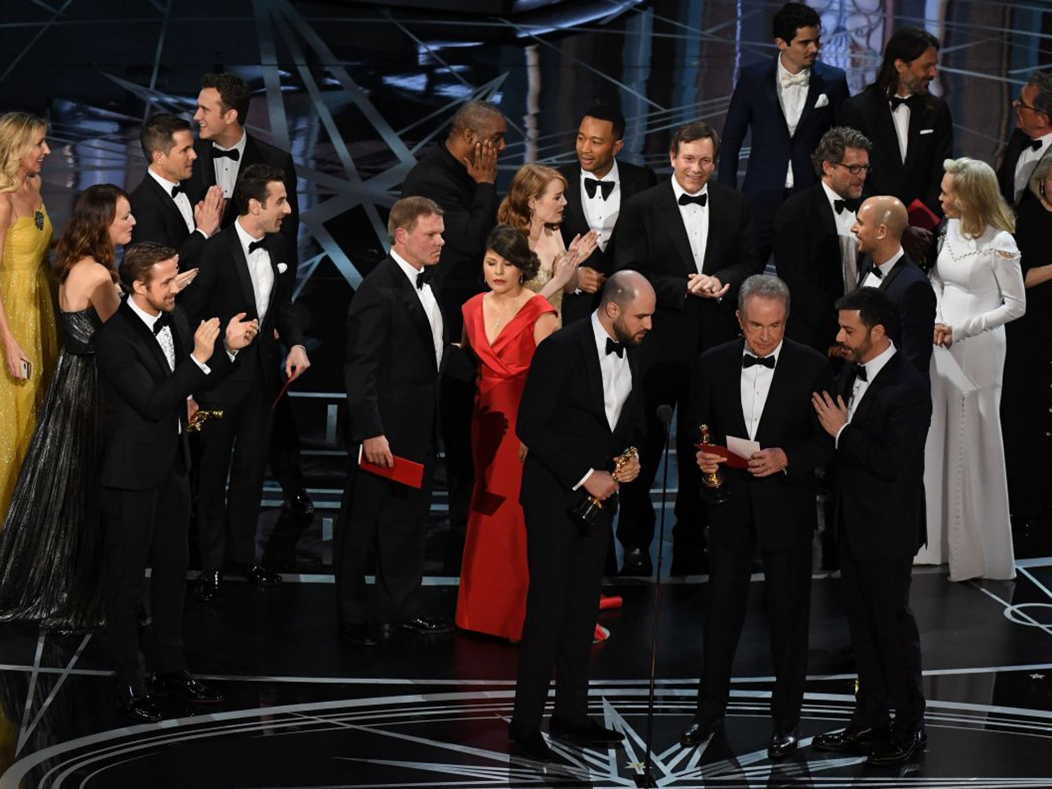 ‘La La Land’ producer Jordan Horowitz (centre) looks at the card reading ‘Best Film: Moonlight’ as it becomes clear a mistake has been made