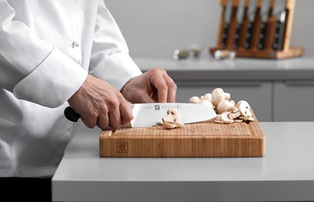 The rounded tip of a santoku knife helps to balance the blade in the hand