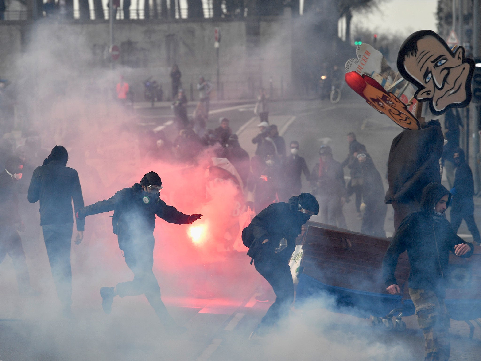 Anti-establishment demonstrators protest ahead of a campaign rally by Front National leader Marine Le Pen in Nantes on Saturday