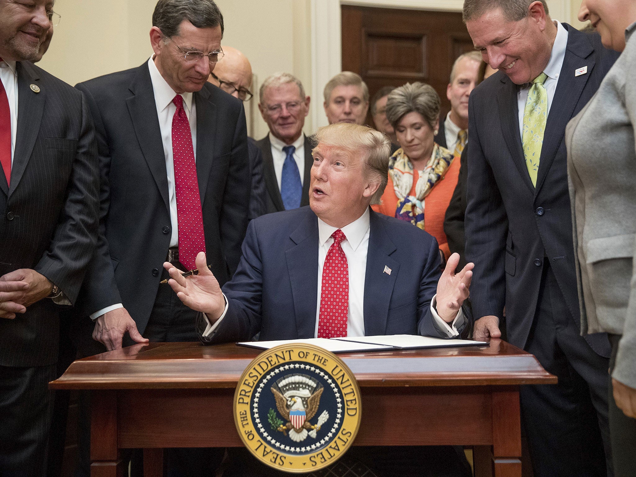 President Donald Trump speaks as he signs an order withdrawing the Waters of the United States (WOTUS) rule, 28 February 2017