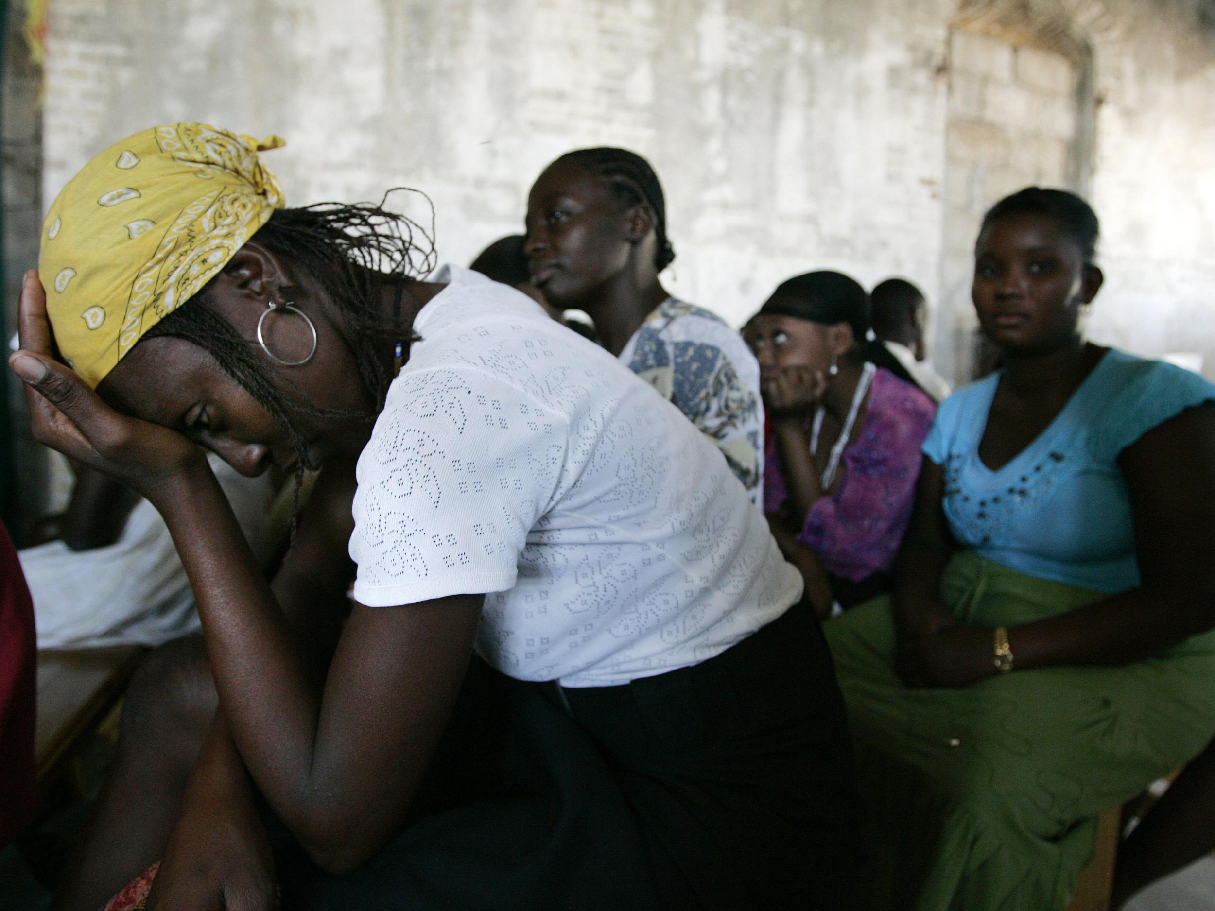 A woman waits for the result of her pregnancy test in an clinic in Haiti