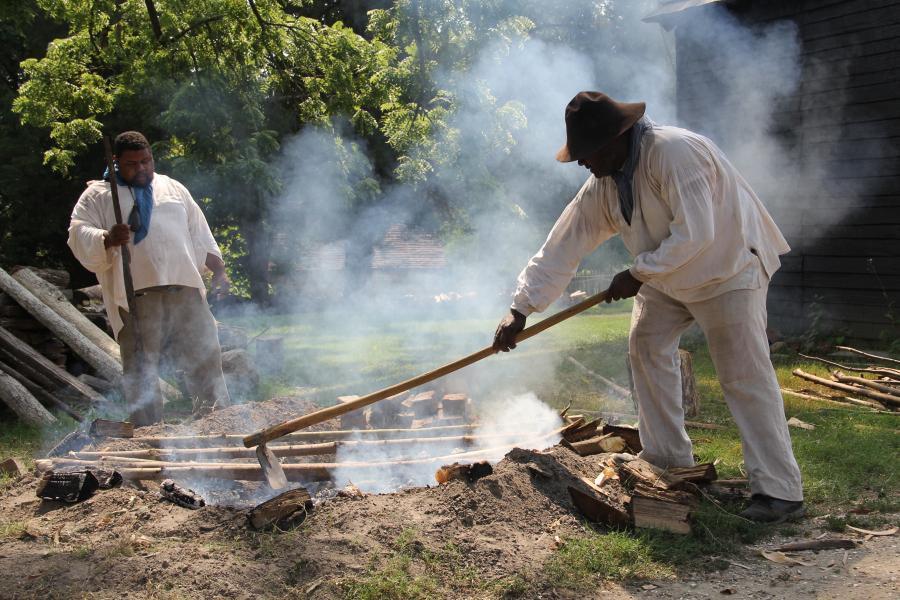 Michael Twitty (left) interprets what it was like to cook as an enslaved person at US plantations in his Southern Discomfort Tour