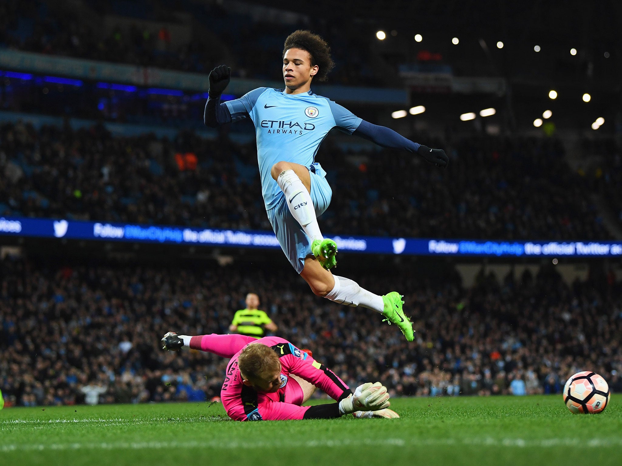 Leroy Sane is foiled by goalkeeper Joel Coleman