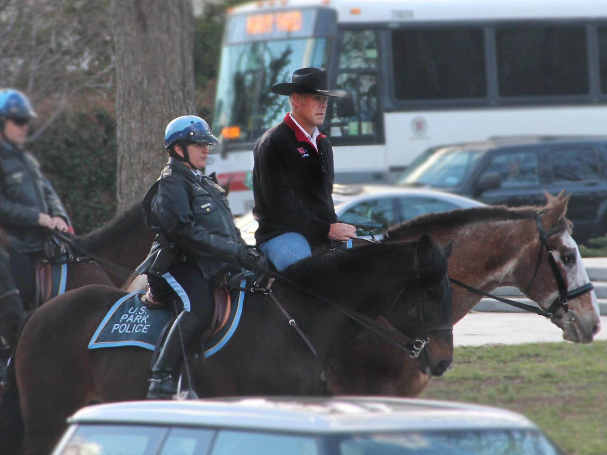 Interior Secretary Ryan Zinke arrives for work on horseback on his first day in the job