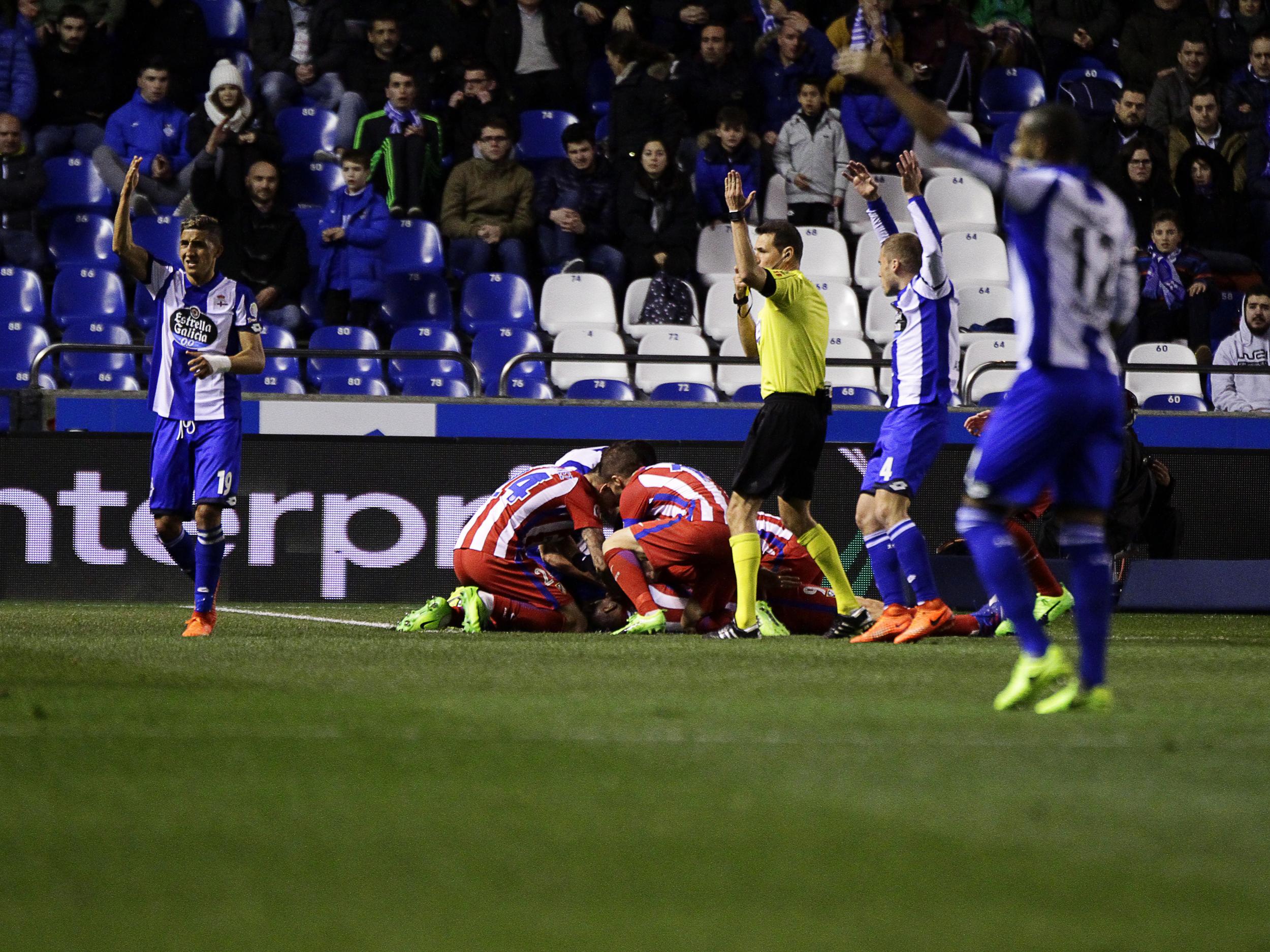 The player's team-mates quickly came to his aid