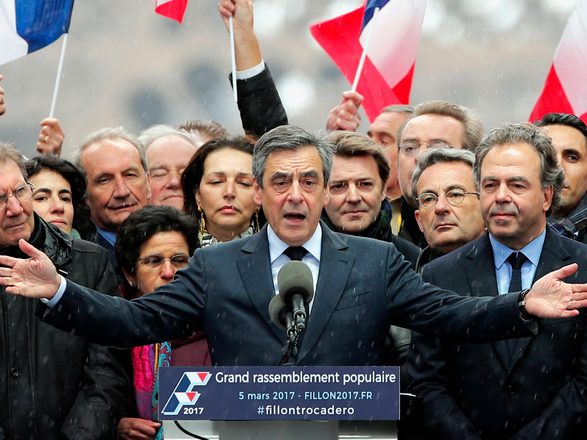 French conservative presidential candidate Francois Fillon urges his supporters not to "give up the fight" for the presidency during a rally in Paris.