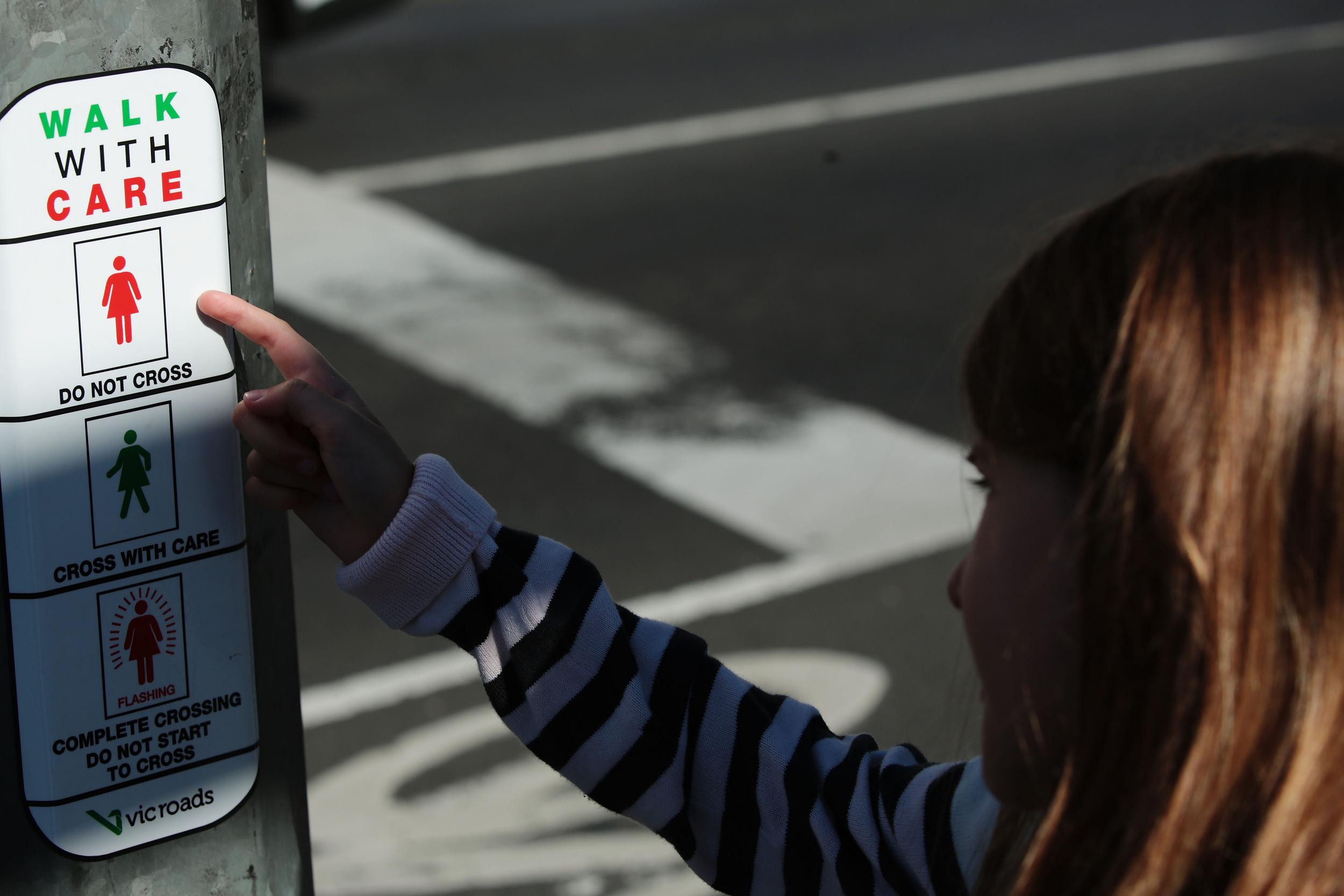 Female traffic light signals are installed at the intersection of Swanston and Flinders streets