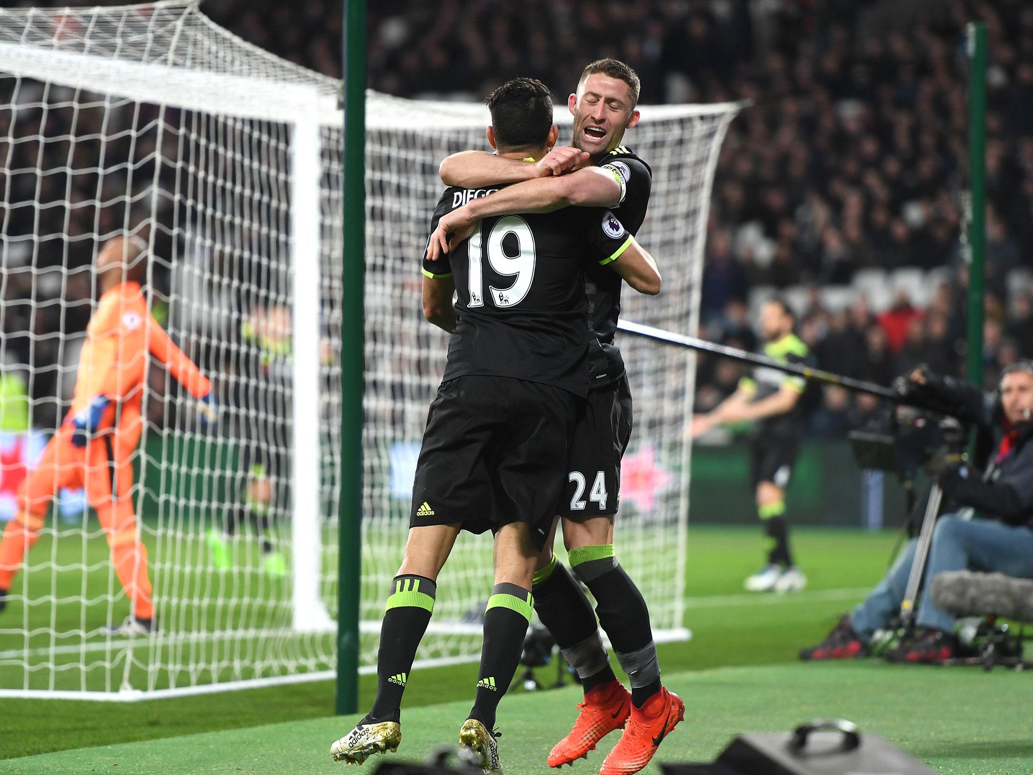 Gary Cahill celebrates with Diego Costa after the striker secured Chelsea's 2-1 win over West Ham