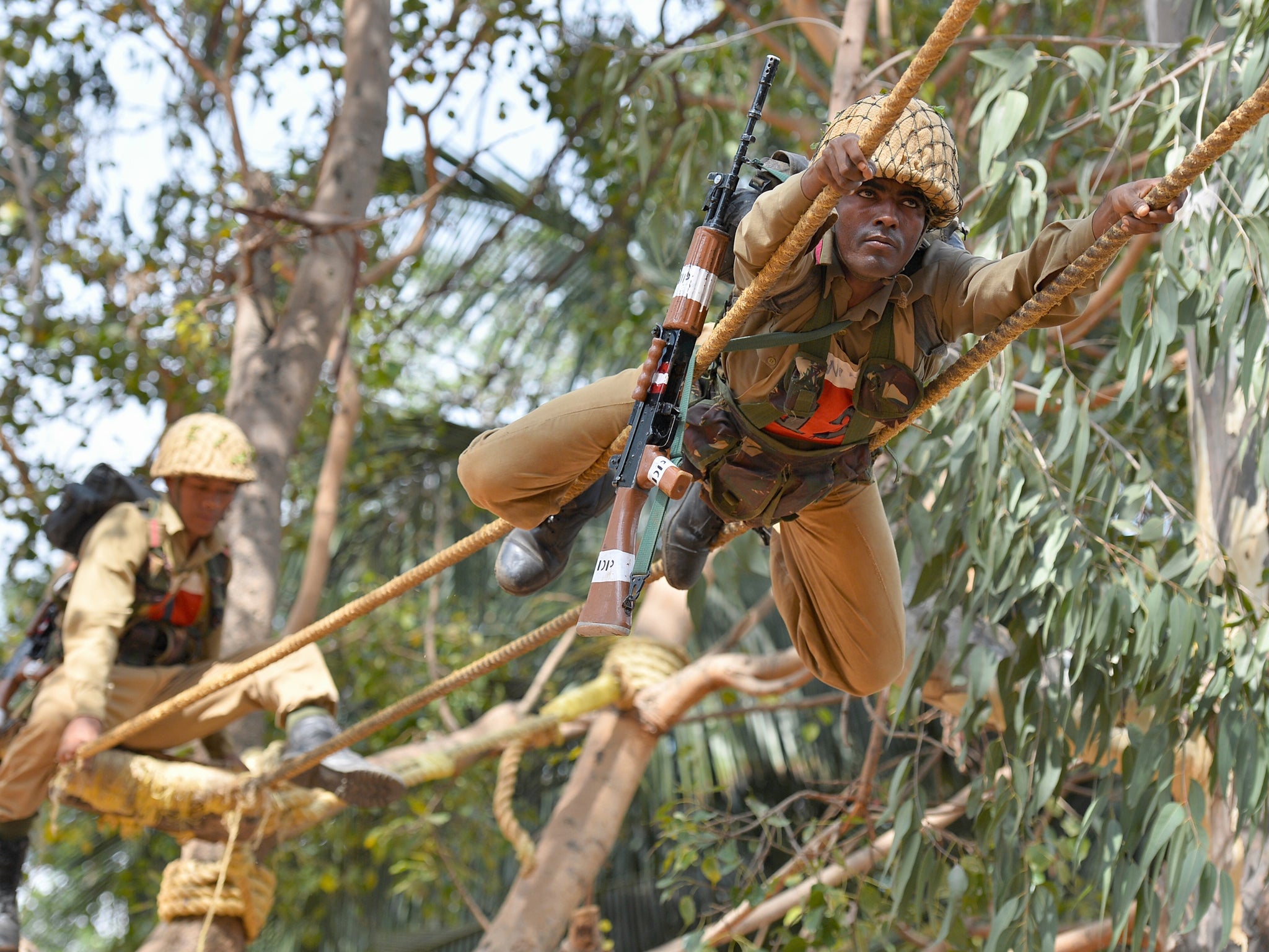 Indian Army soldiers from the Army Services Corps (ASC) Centre and College take part in a training and combat preparedness demonstration in Bangalore