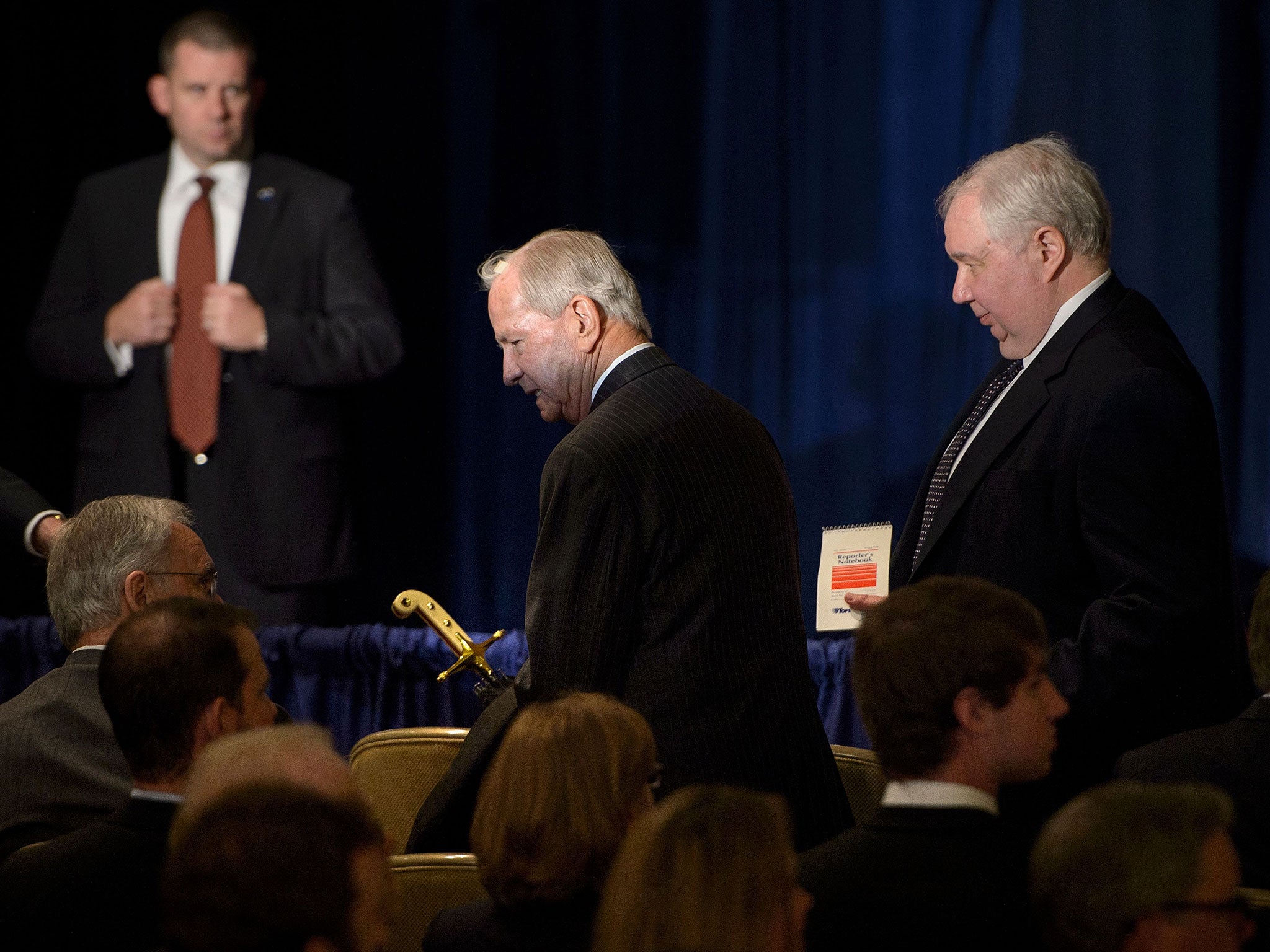 Former US Secretary of State James Baker (C) arrives with Sergey Kislyak (R) to listen to Donald Trump speak about foreign policy at the Mayflower Hotel