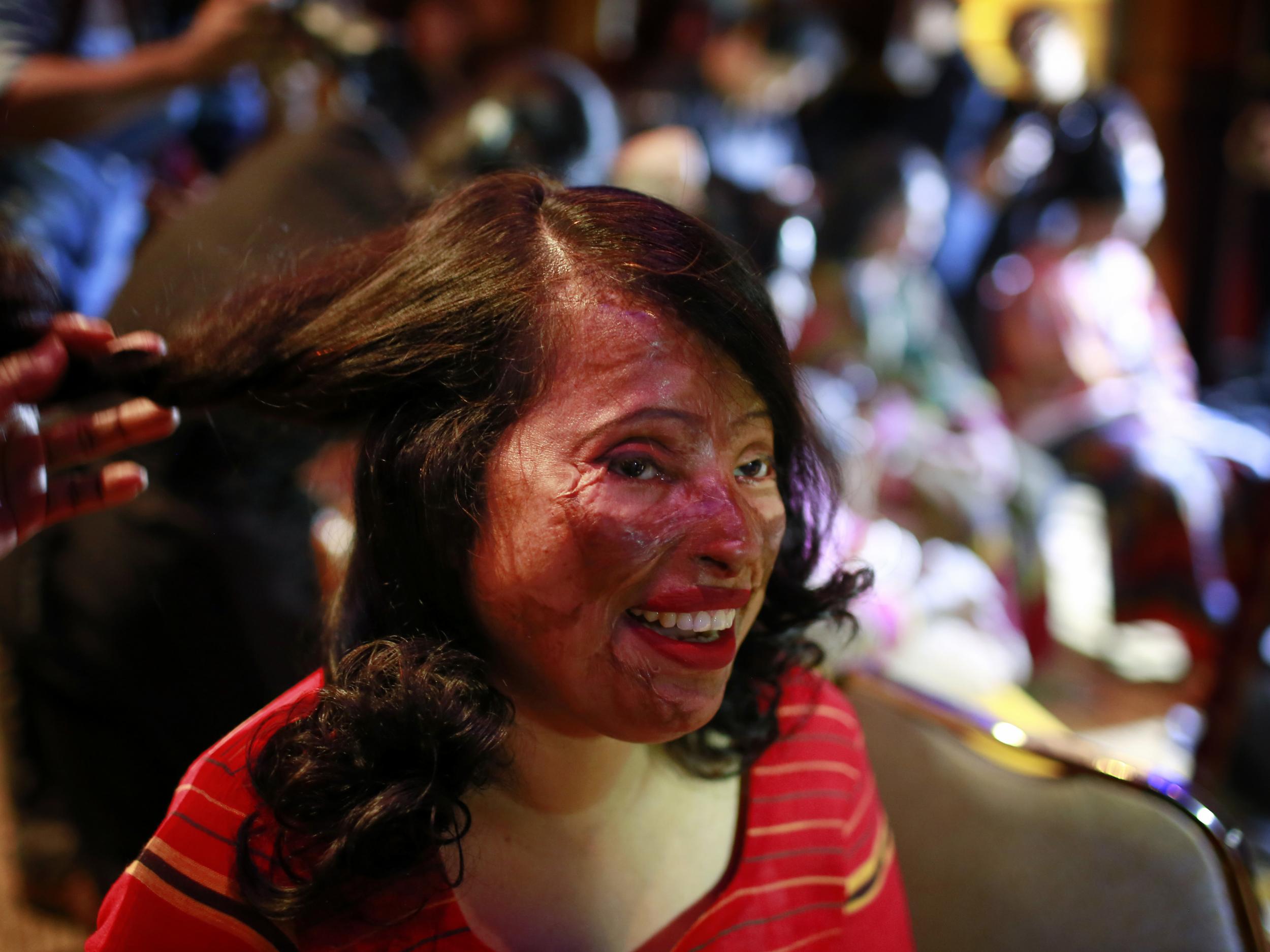 A survivor gets her make up applied ahead of the event