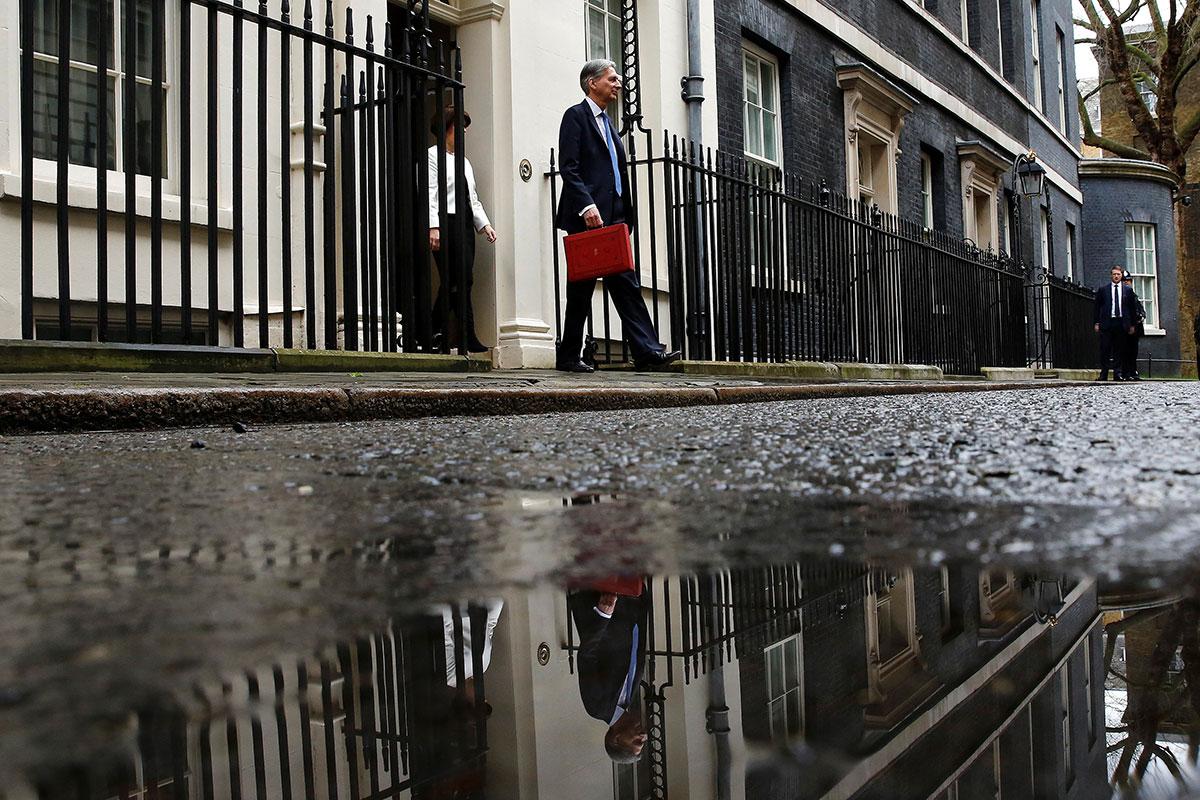 Philip Hammond steps out of 11 Downing Street for his first Budget