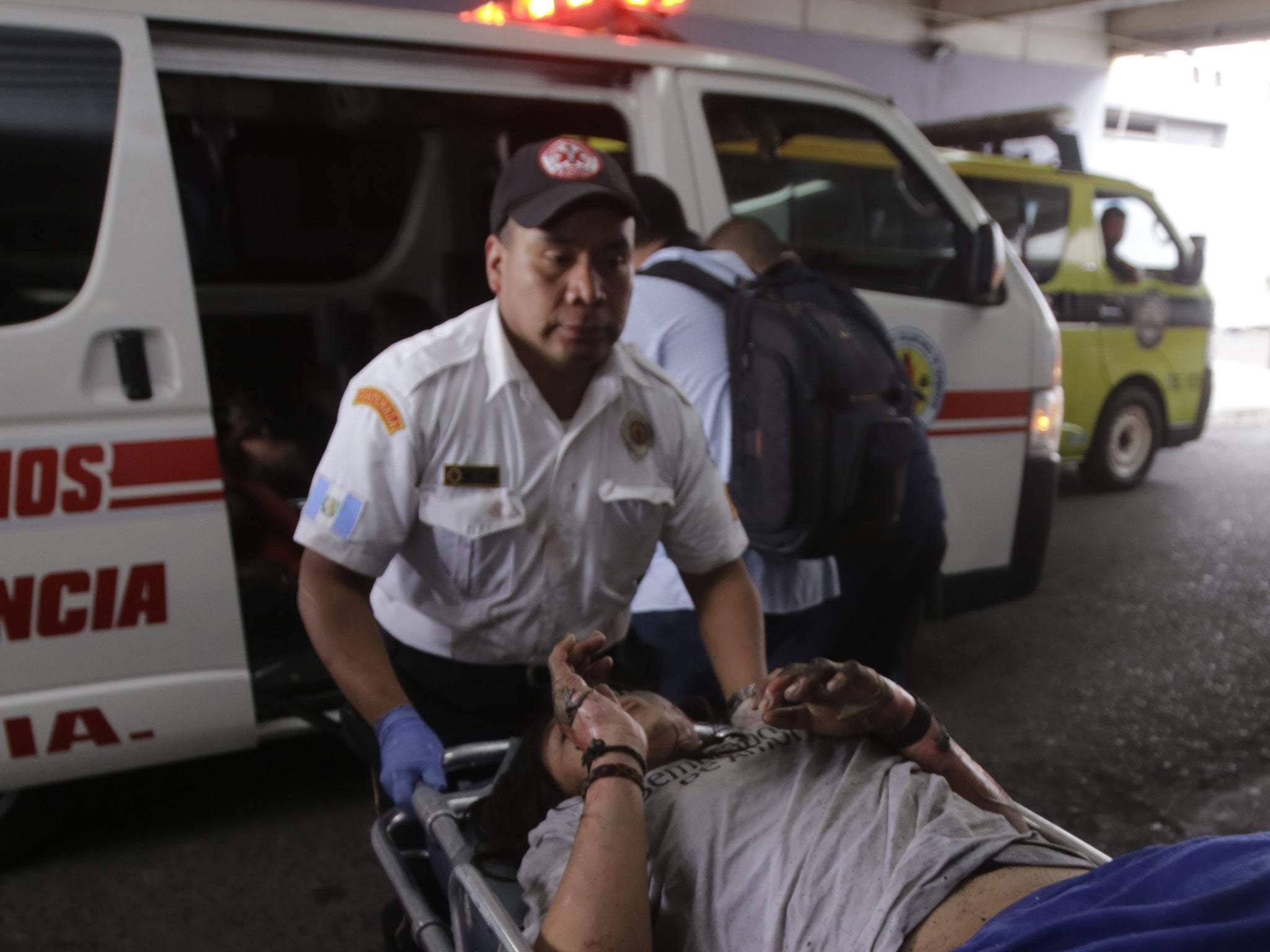 A victim of a fire at the children's shelter Virgen de la Asuncion, is rushed into a hospital in San Jose Pinula, about 30km east of Guatemala City