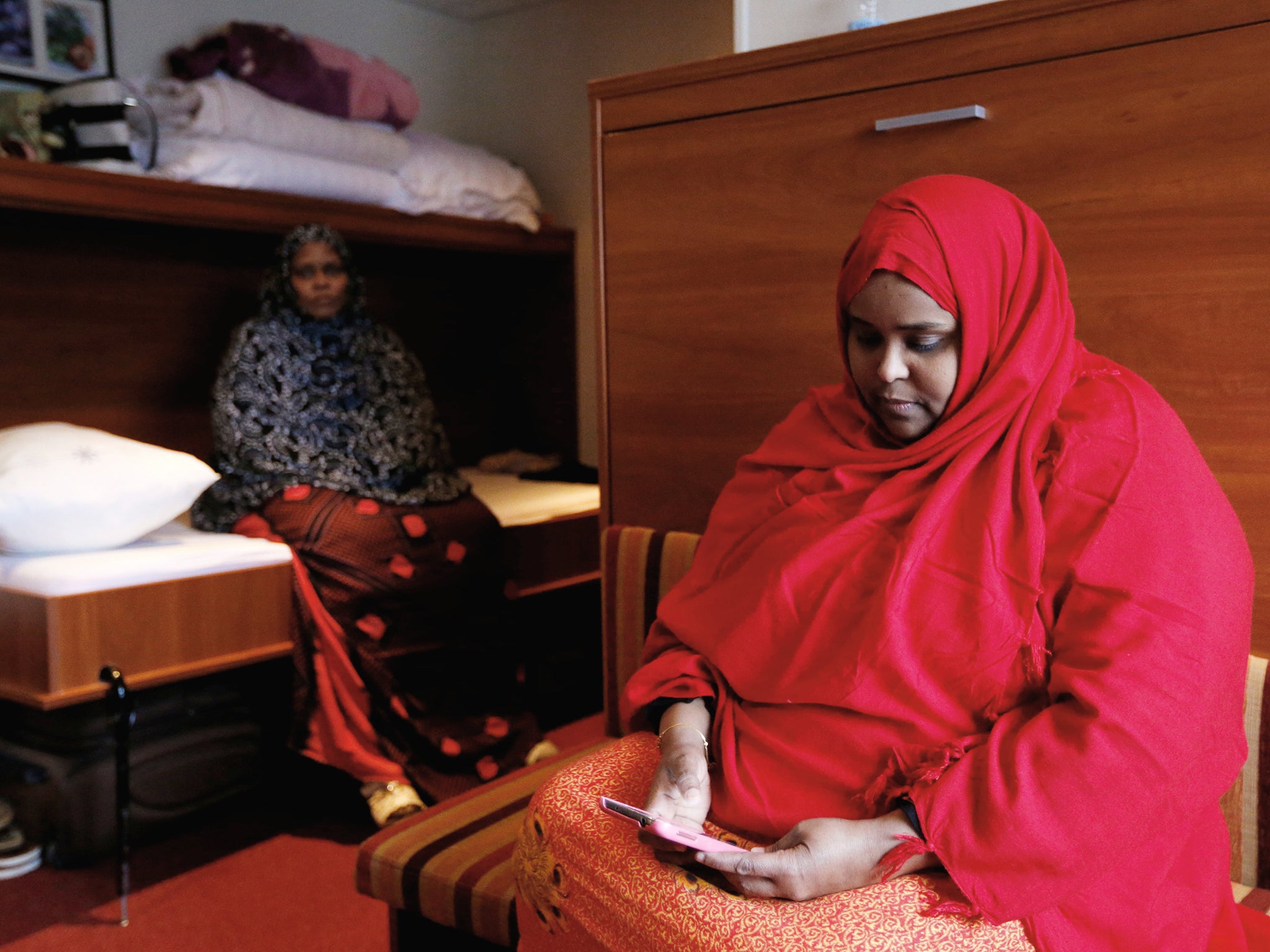 The cabins of the ship are only a temporary refuge for asylum seekers, including Slaha Mahamud Abukar (right) and Rugya Hassan Mohamed, who have fled from Somalia