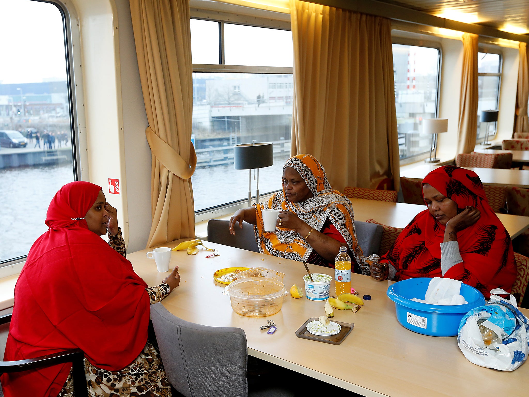 Women from Somalia eat lunch in the ship’s shared dining room