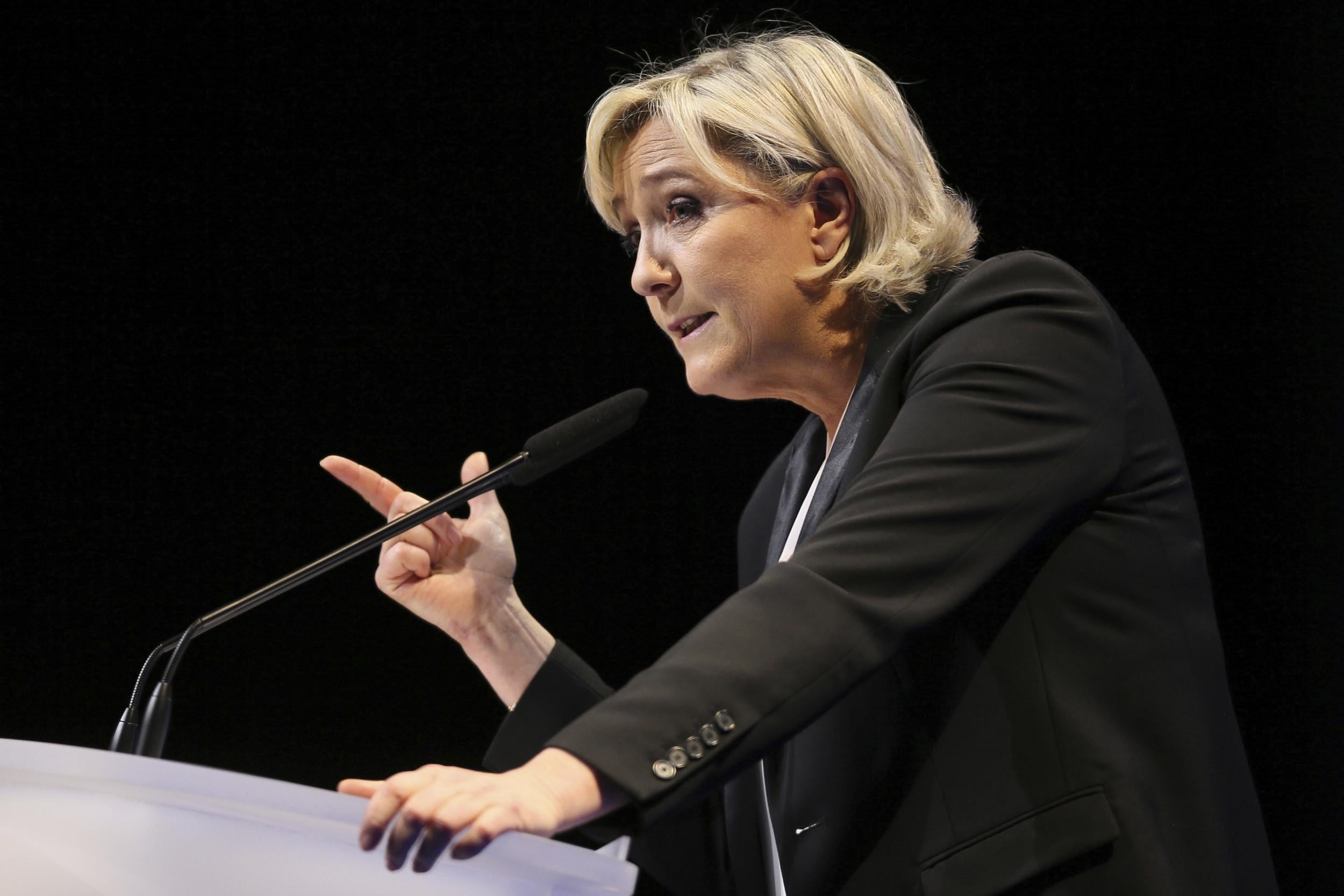 Hard-right French Nationalist presidential candidate Marine Le Pen gestures speaks during a conference in Nantes