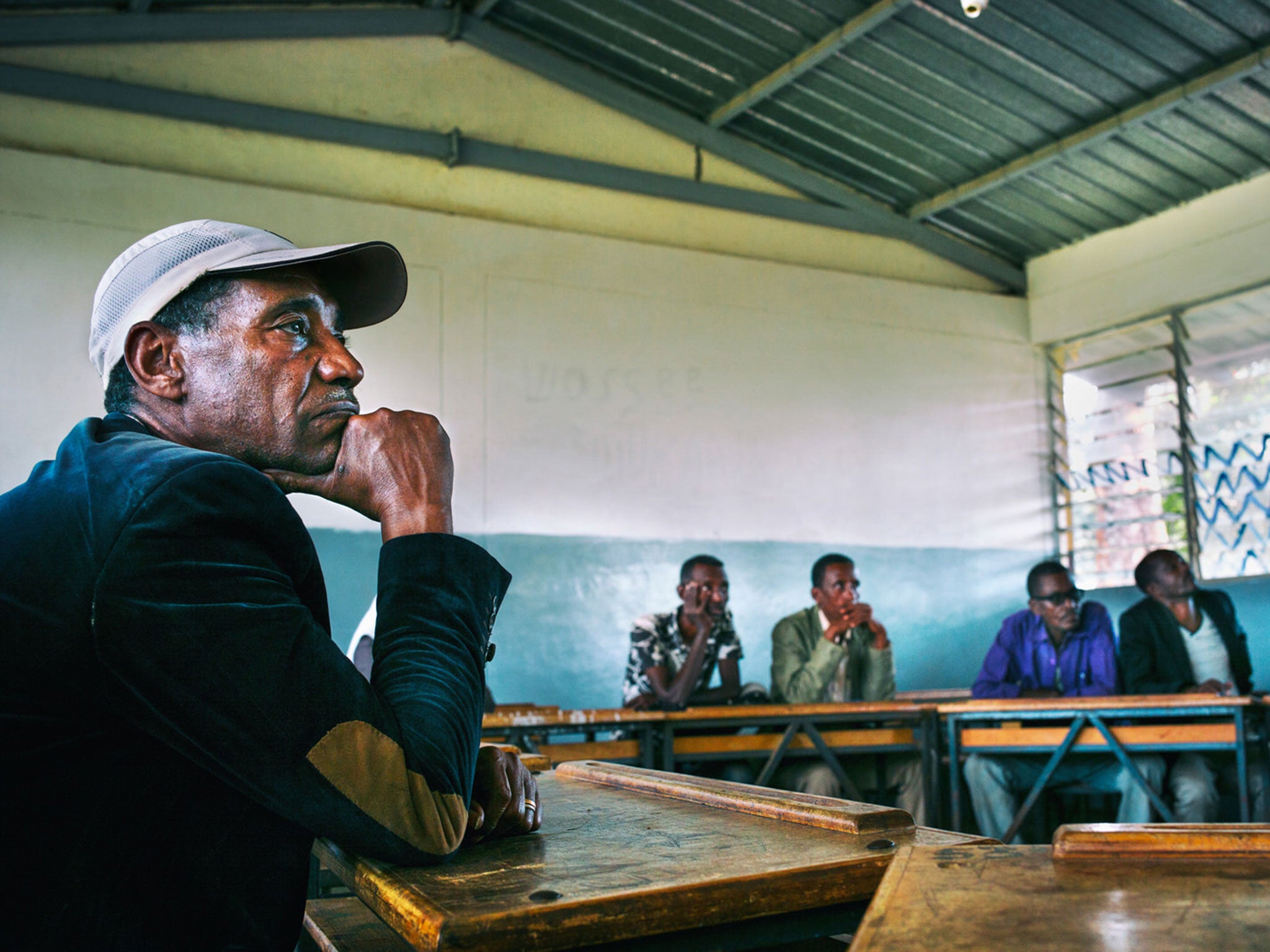 Members of a coffee cooperative in Yayu talking business with Graciano Cruz, an industry expert and coffee farmer himself, who along with Union is helping development in the region