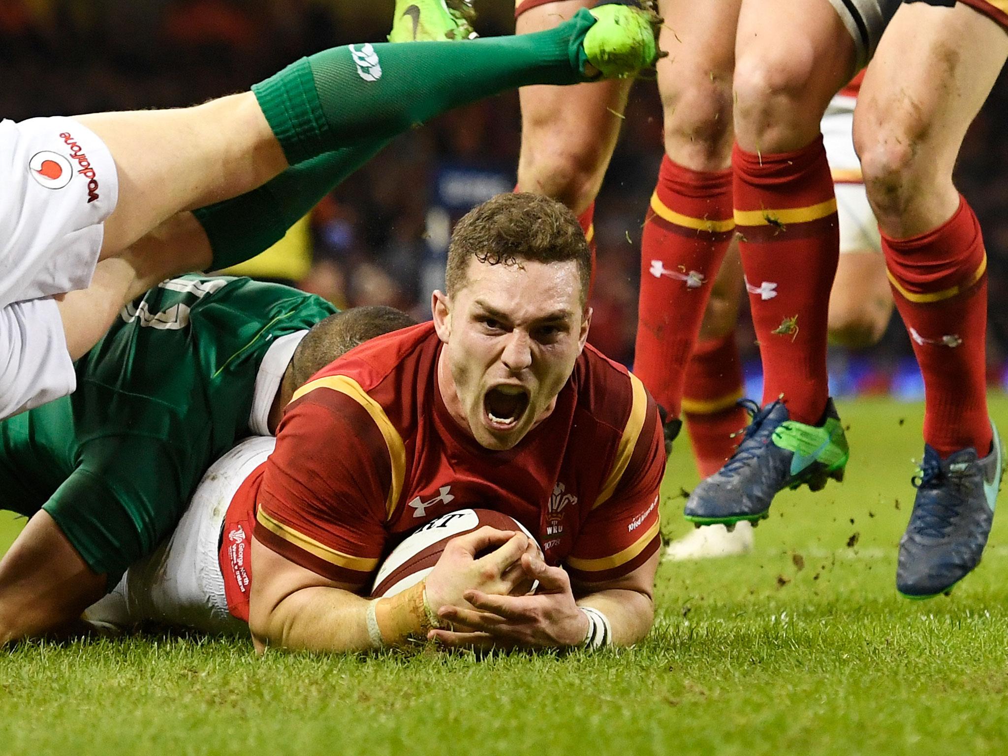 George North celebrates scoring the opening try for Wales