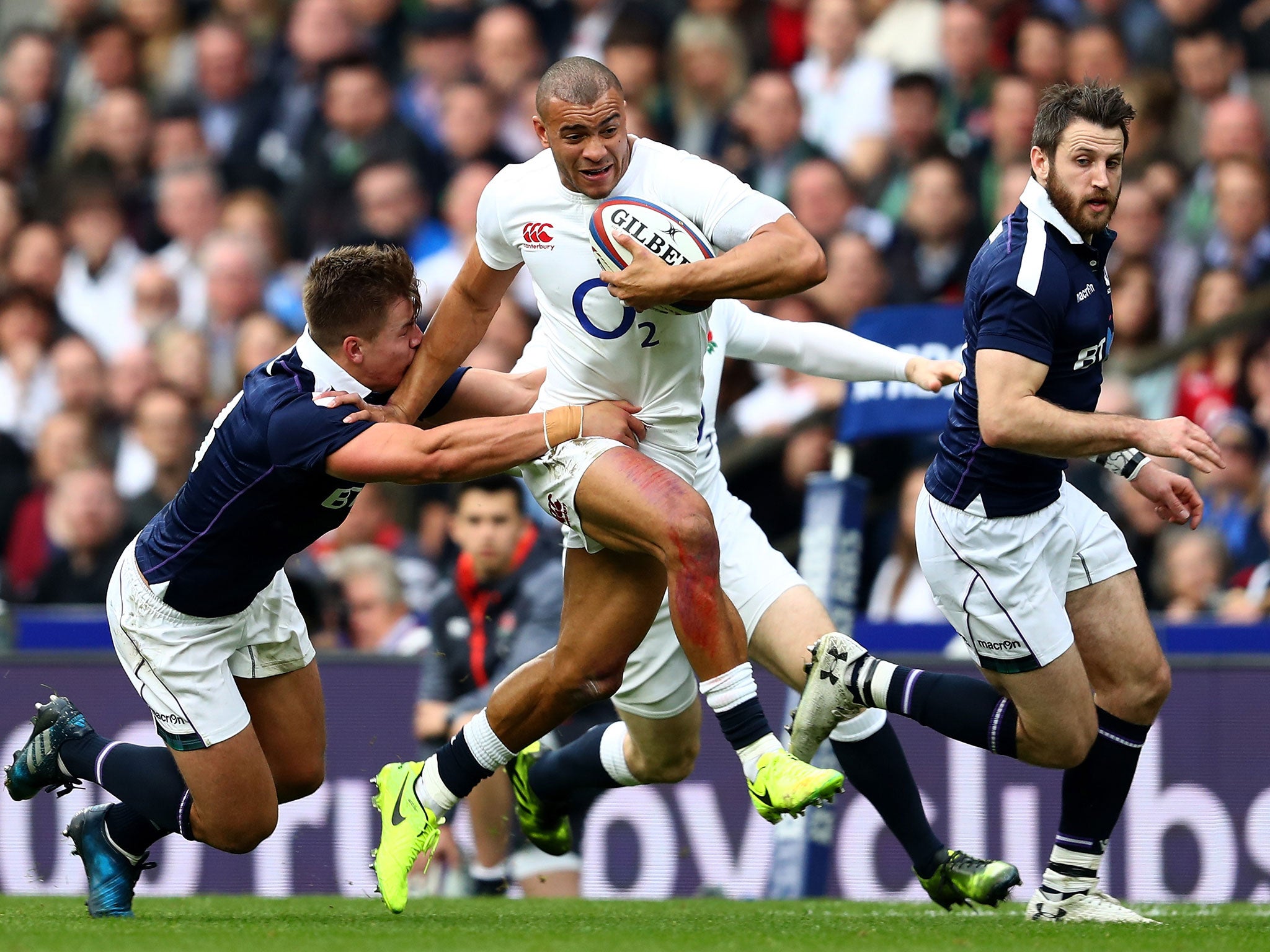 Jonathan Joseph breaks through Scotland's back line before running in England's first try