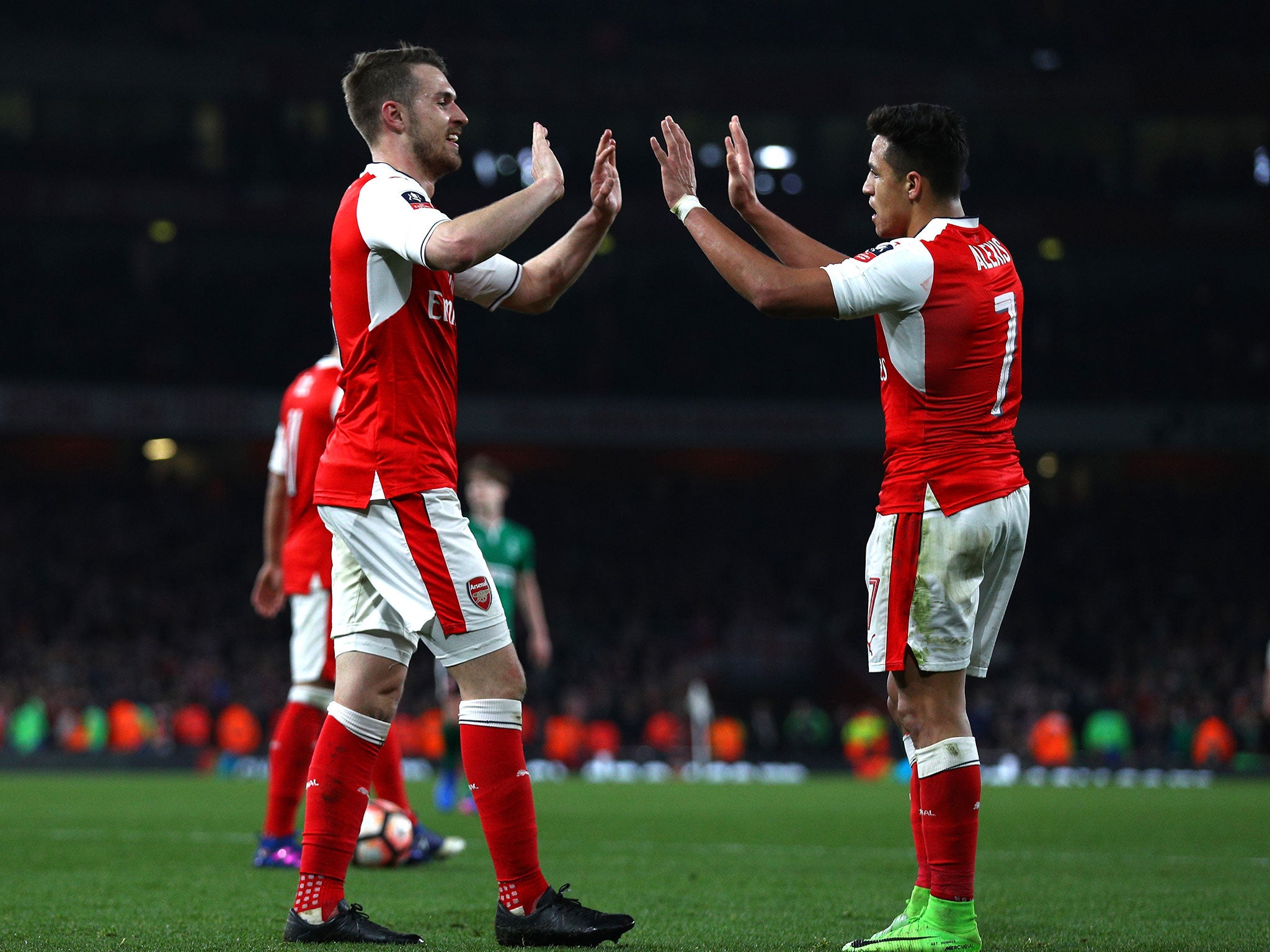 Aaron Ramsey congratulates Alexis Sanchez on his goal