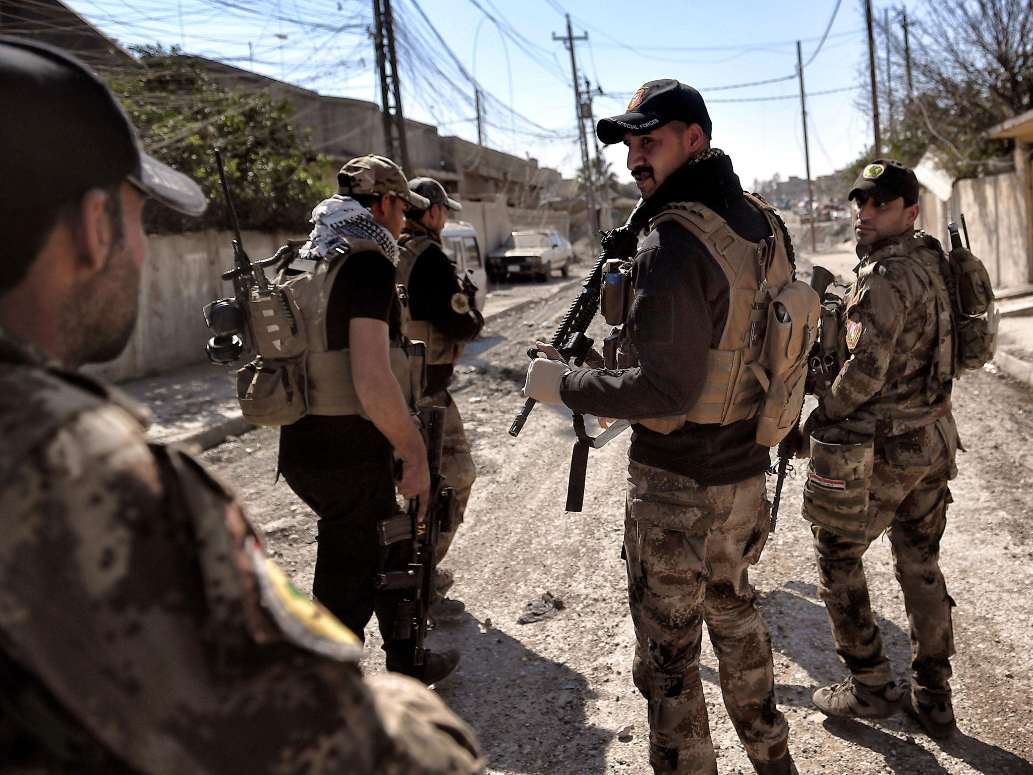 Iraqi troops patrol at retaken areas in west Mosul as they advance in the city in the ongoing battle to seize it from Isis jihadists