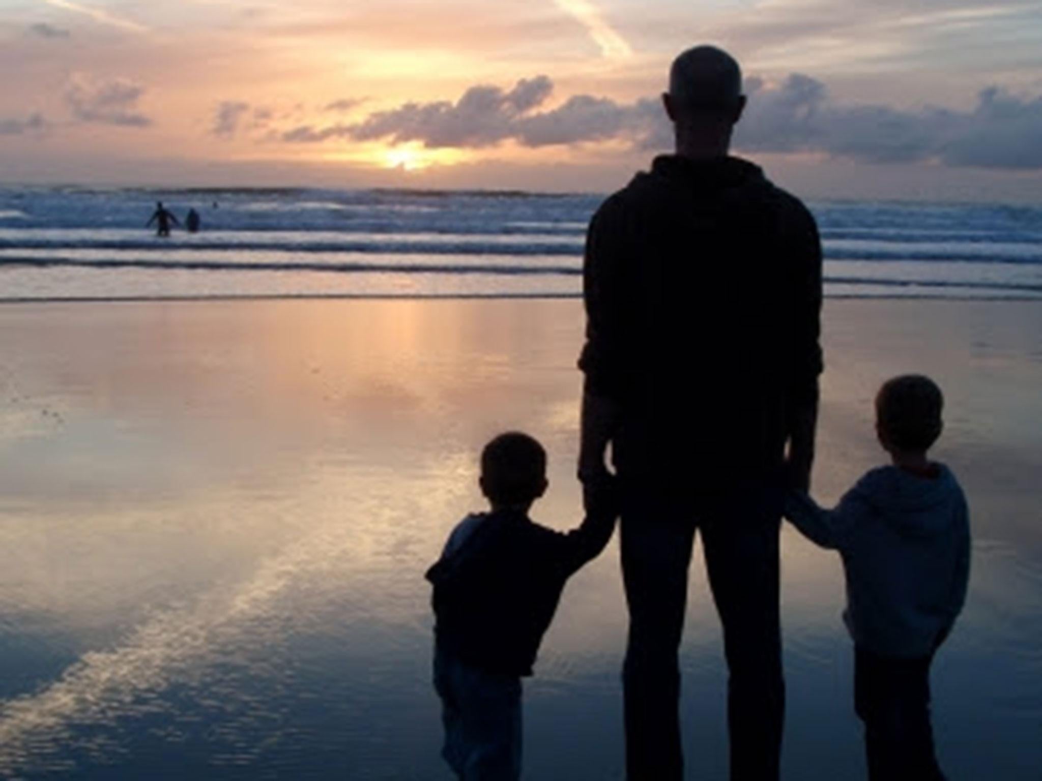 Dunc, who passed away in 2013, with his two young children