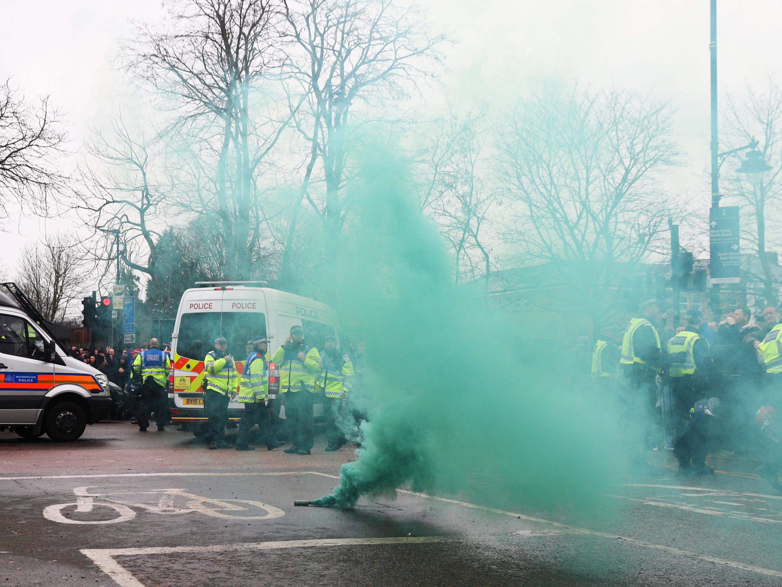 Flares were let off outside the ground before kick-off (Getty)