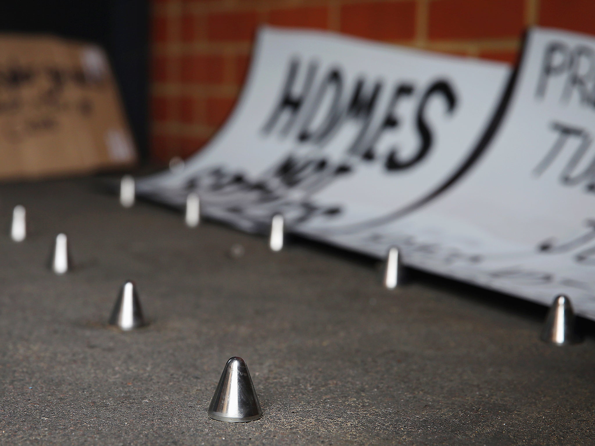 &#13;
Metal spikes outside a private block of residential flats are meant to stop people from sleeping rough outside (Getty)&#13;