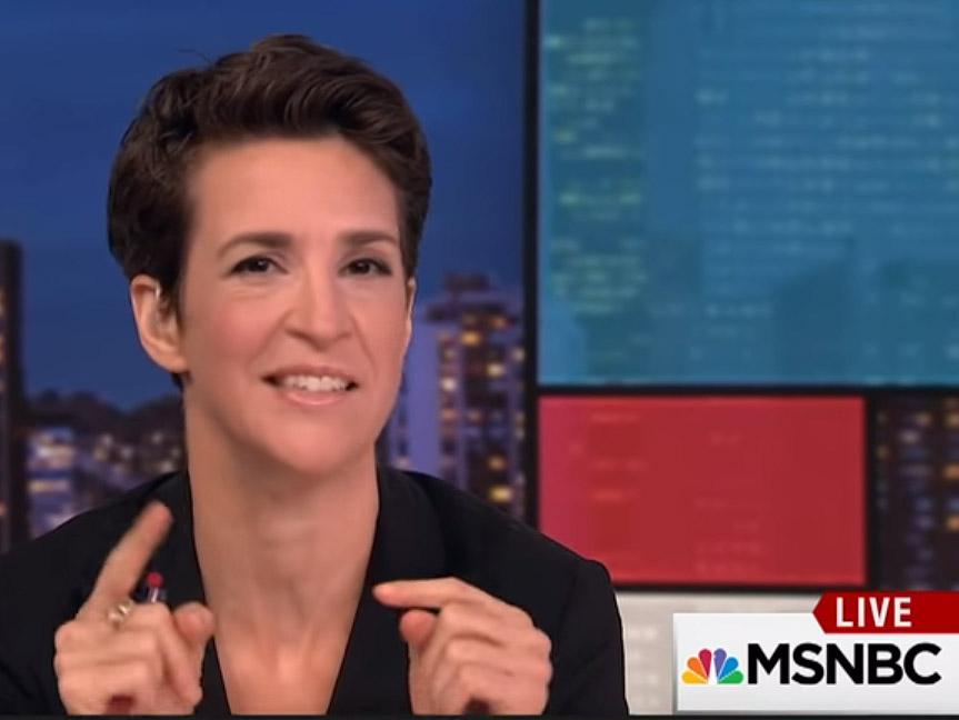 Rachel Maddow hosting her hit MSNBC show