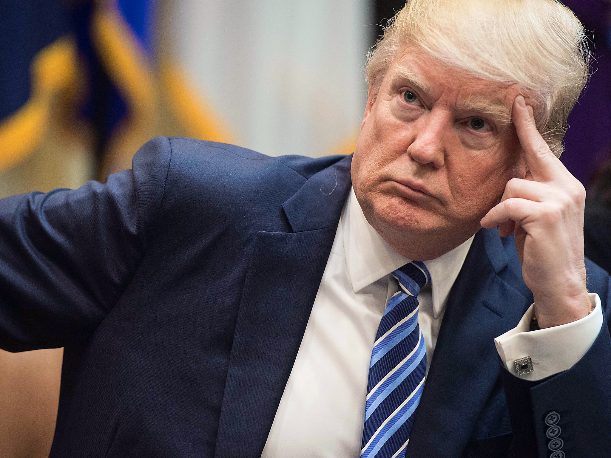 US President Donald Trump attends a meeting about healthcare in the Roosevelt Room at the White House in Washington, DC