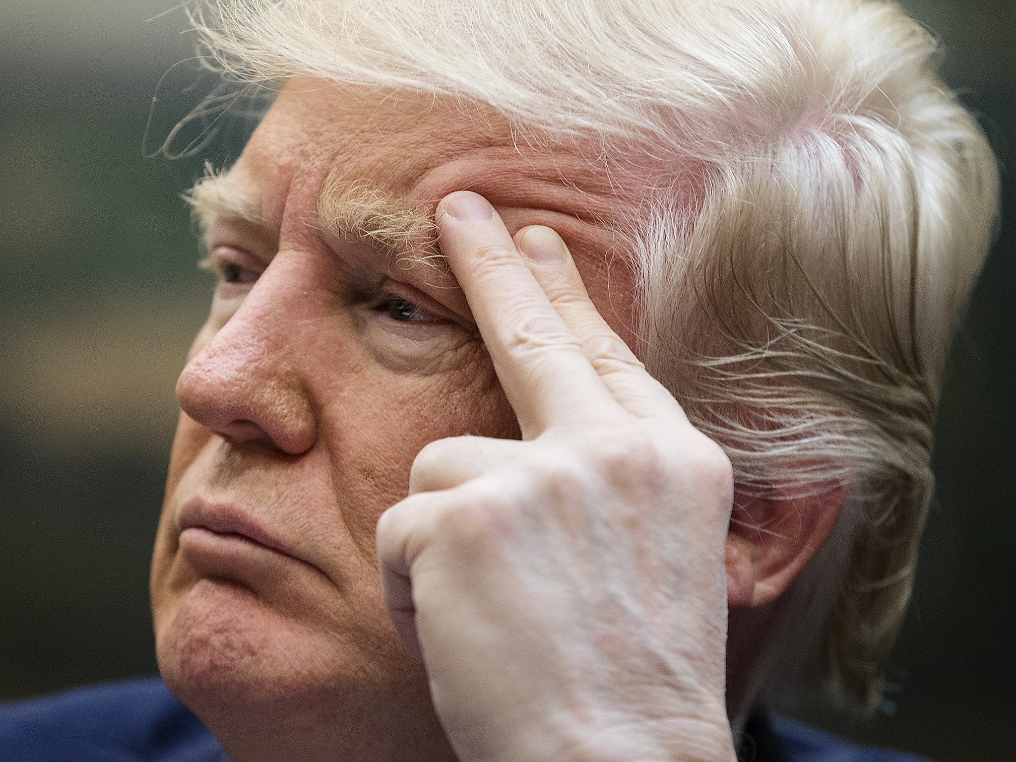 President Donald Trump attends a meeting on healthcare in the Roosevelt Room of the White House