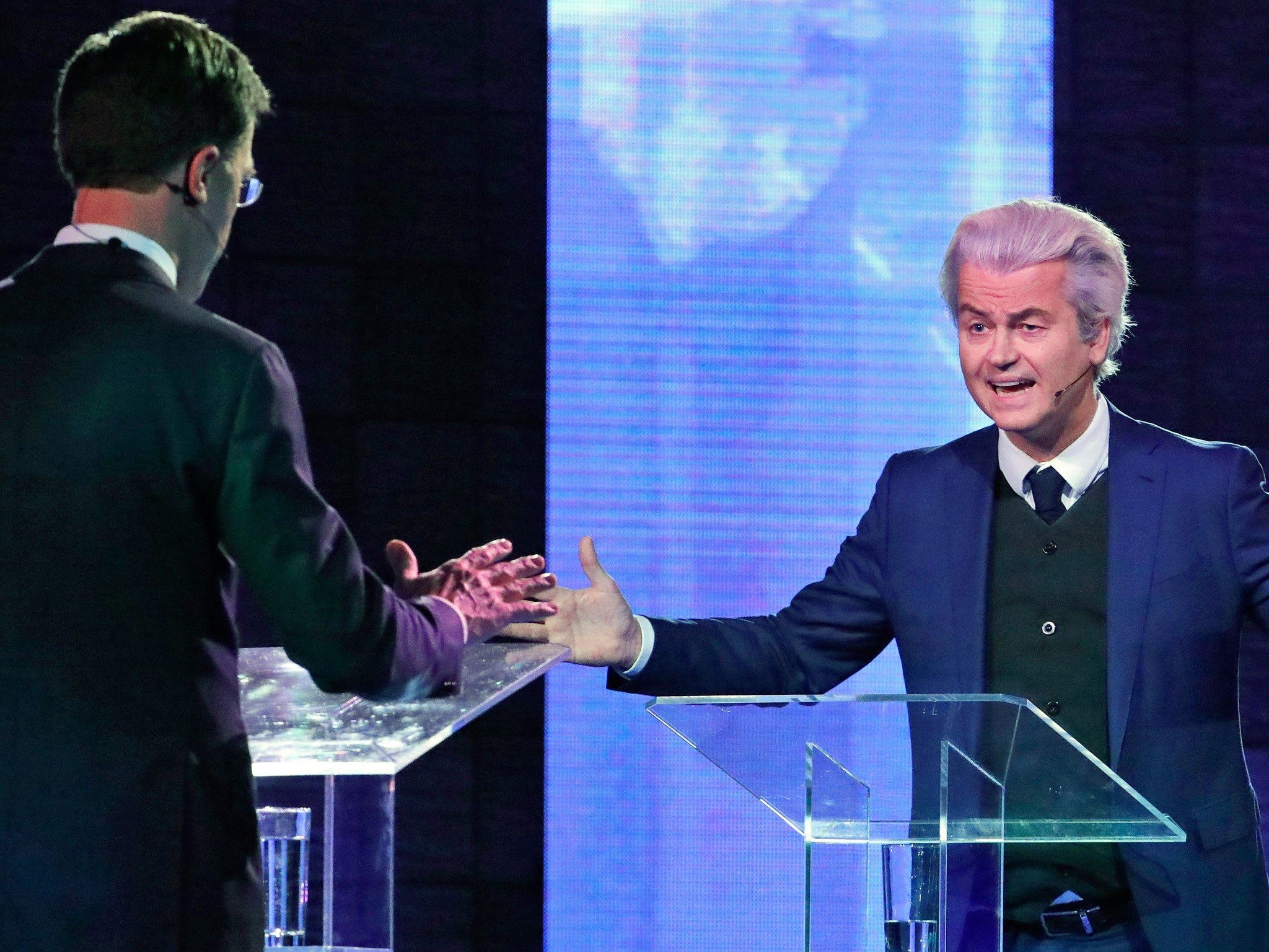 Mr Wilders and Mr Rutte debate in the first head-to-head meeting of the two political party leaders since the start of the election campaign